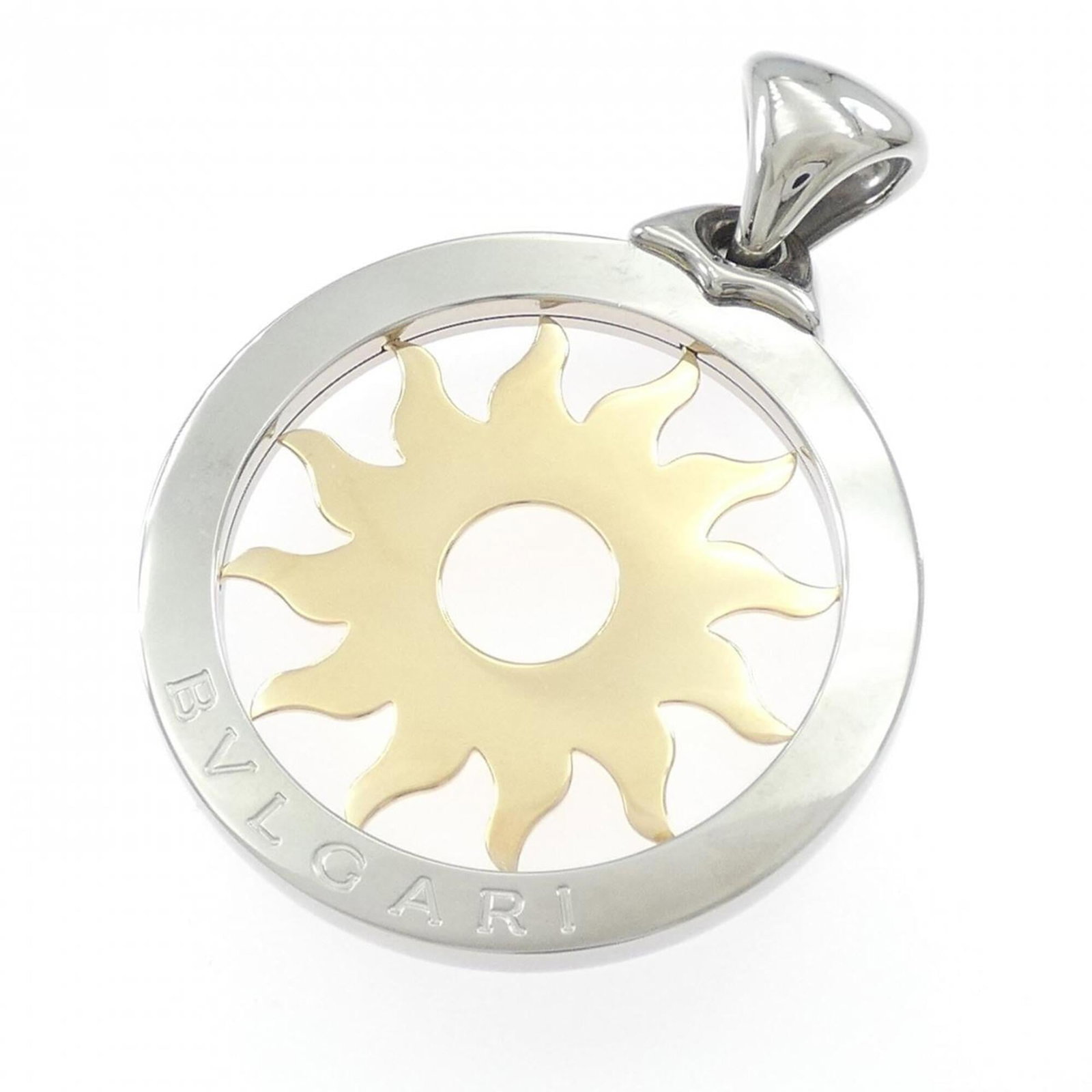 Bvlgari Tondo Sun Pendant: Bvlgari Tondo Sun Pendant Stainless Steel and Yellow Gold (18K) combine in the Bvlgari Tondo Sun Pendant, a striking silver and yellow gold pendant featuring a sun design. The pendant measures 58.9mm 