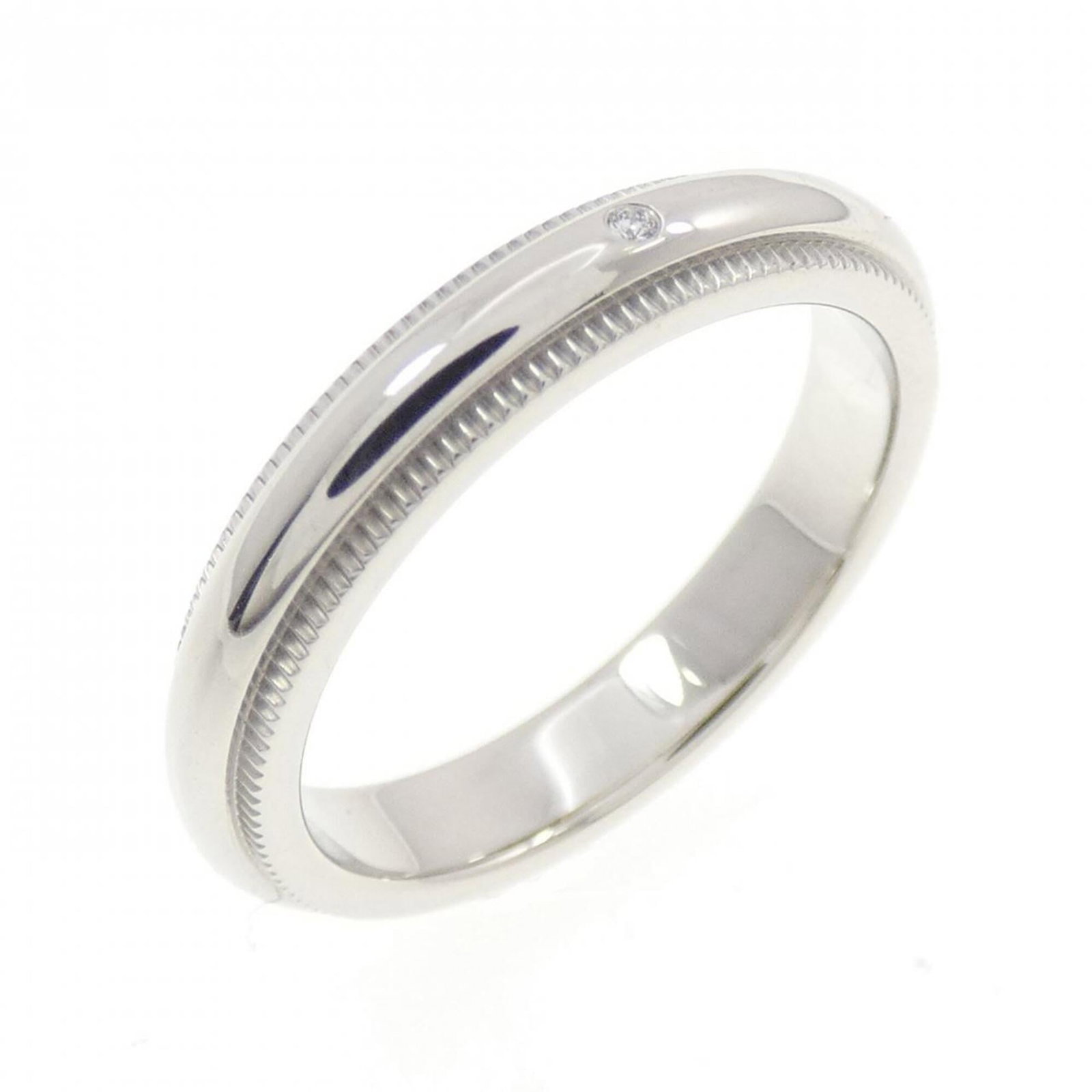 Ring by Tiffany Co: Ring by Tiffany Co This Tiffany Co. platinum ring features a silver finish and measures 3.5 in US size, making it a versatile accessory for everyday wear. The item has some minor scratches and dirt,