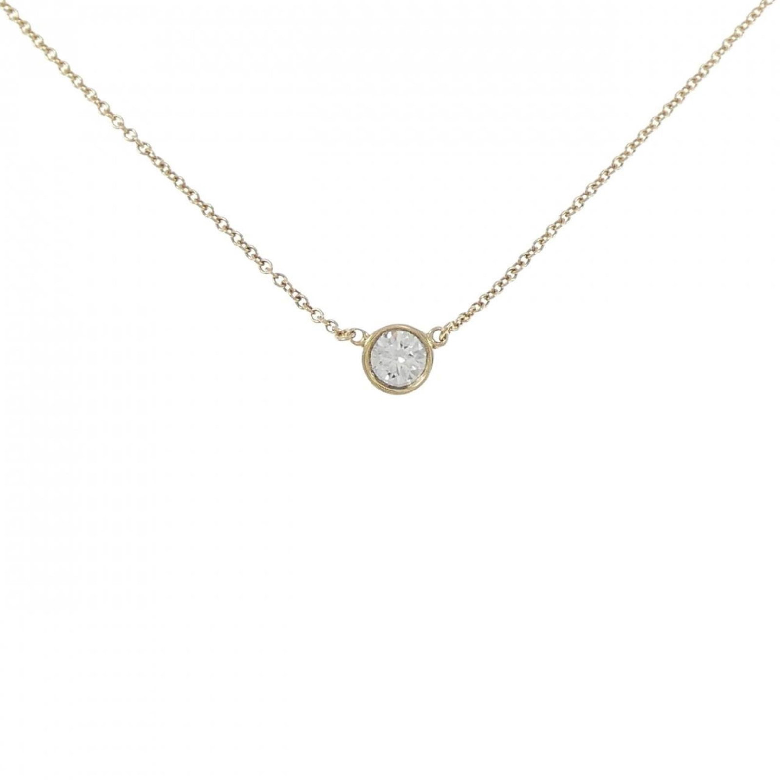 Tiffany by yard necklace: Tiffany by yard necklace Yellow gold (18K) Tiffany necklace featuring a diamond pendant, with a 37 cm circumference and 5.5mm pendant size, bearing a signature. The necklace has some scratches and dir