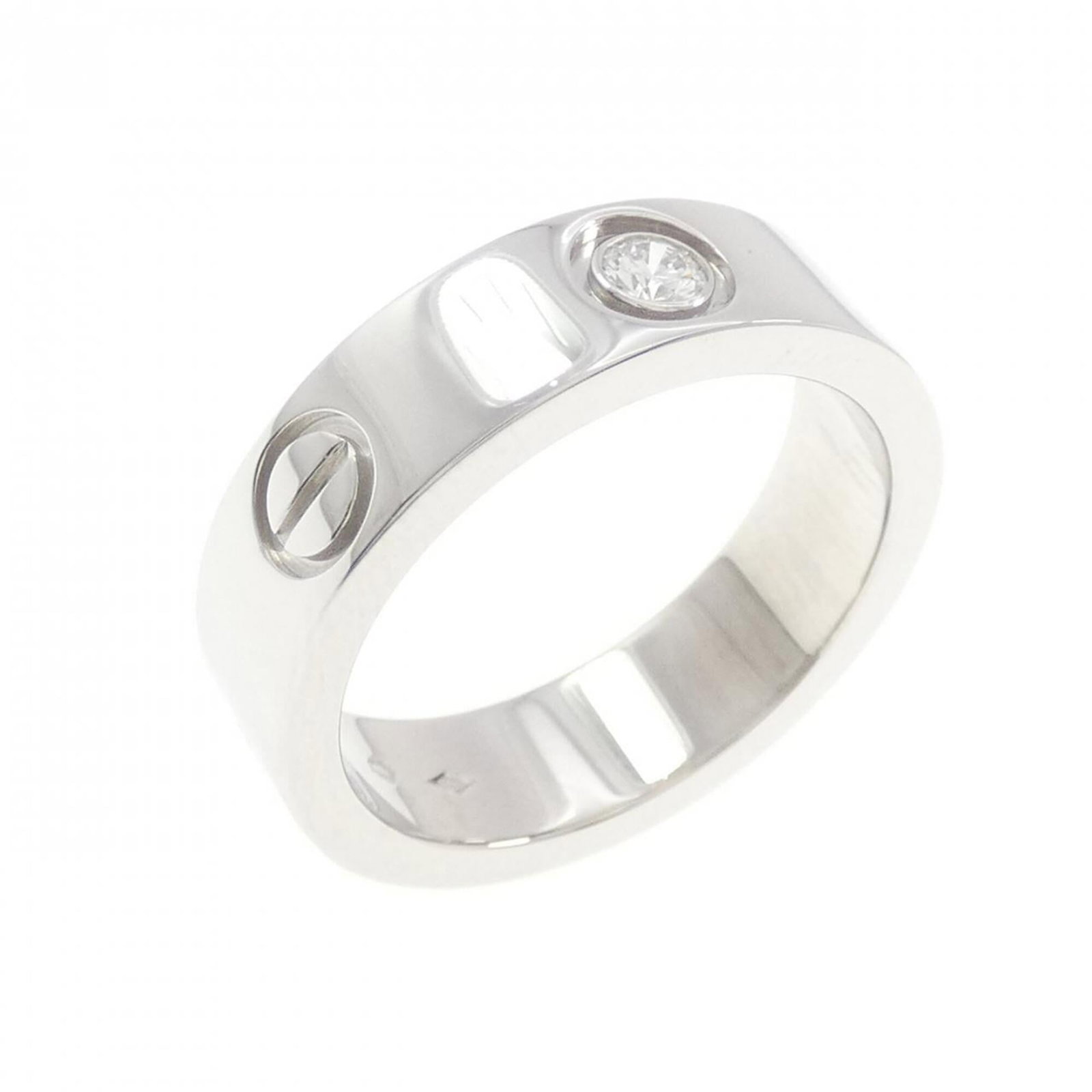 Ring Band by Platinum 950: Ring Band by Platinum 950 Platinum 950 band ring from Cartier, featuring a diamond stone and a sleek design. This used item has hardly any traces of usage and is in like new condition. The ring bears 