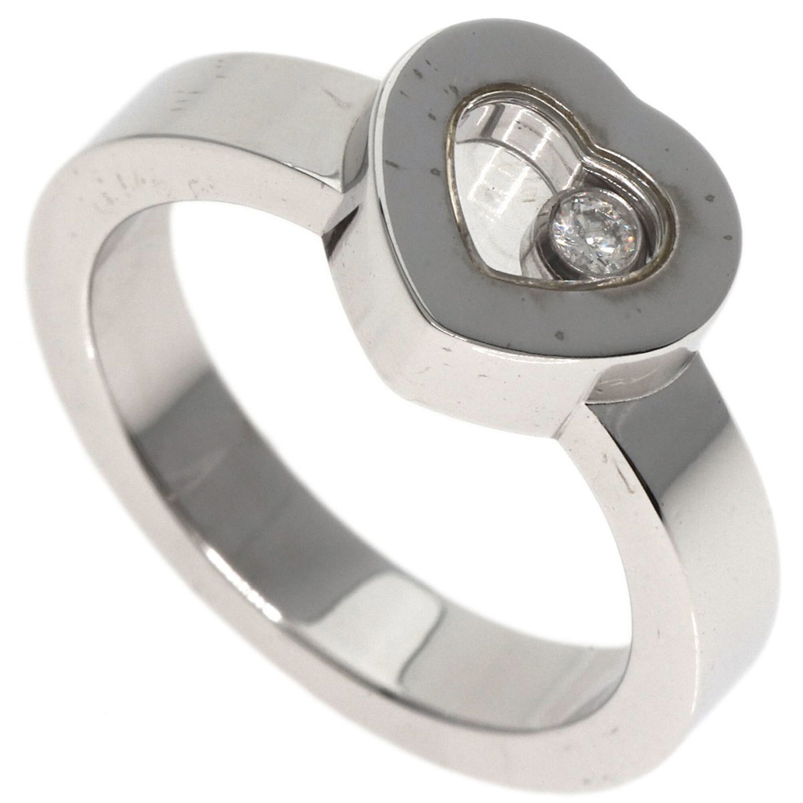 Chopard 18k White Gold Band Ring: Chopard 18k White Gold Band Ring 18k White Gold Band Ring from Chopard, featuring a diamond stone set in an elegant band design. The ring showcases some subtle signs of usage, with a few scratches