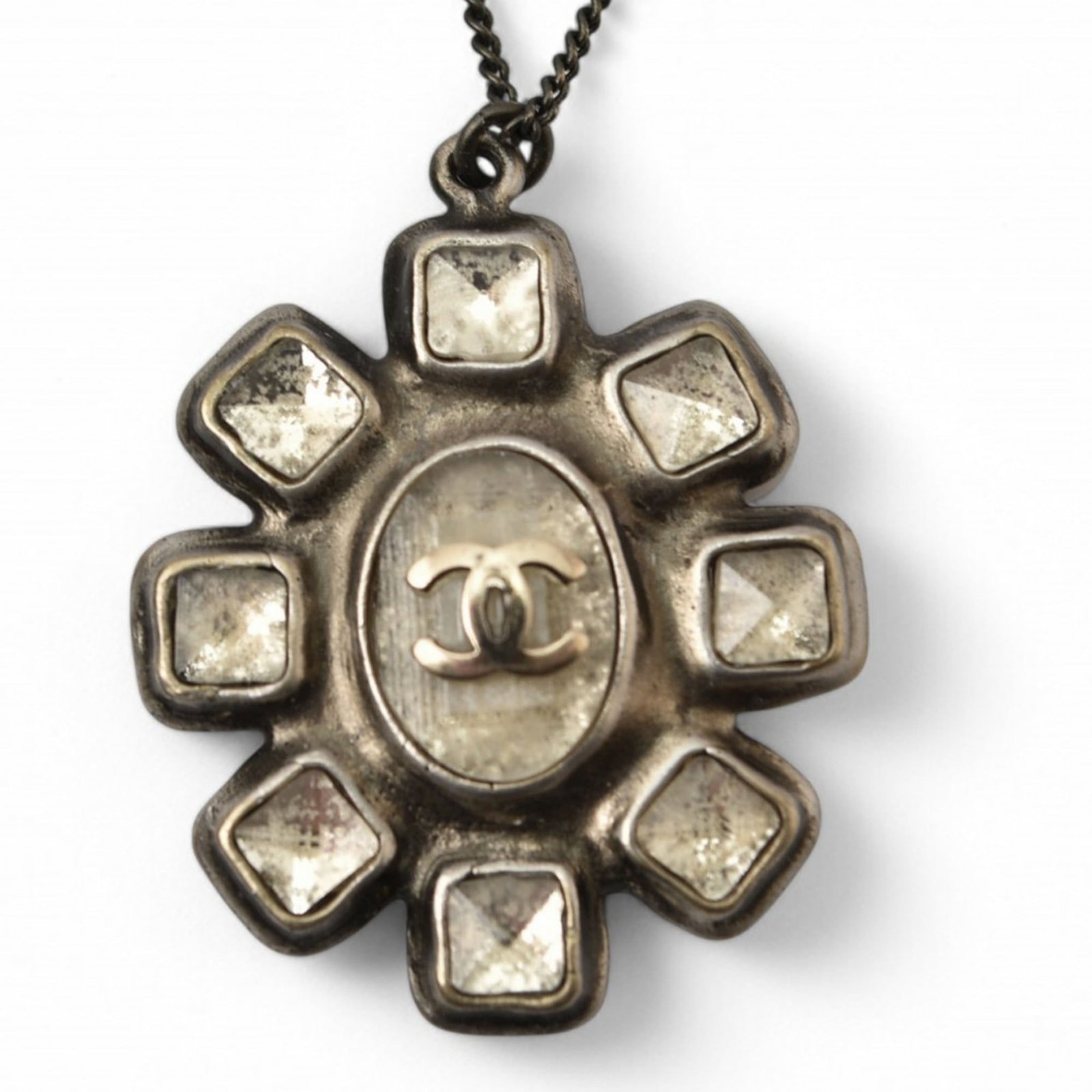 Chanel Rhinestone Gunmetal Coco Cc Chanel 10C Necklace Pendant: Chanel Rhinestone Gunmetal Coco Cc Chanel 10C Necklace Pendant Gold plated gunmetal Coco Cc Chanel necklace pendant, featuring intricate details and a striking design. The 30mm x 27mm pendant measures