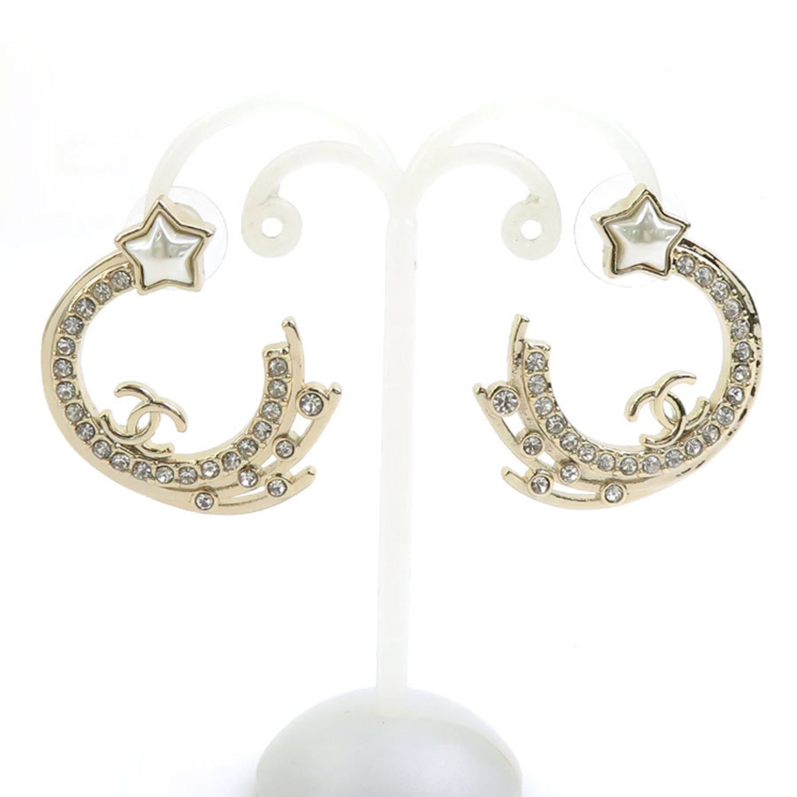 Stud Earrings Metal by Chanel: Stud Earrings Metal by Chanel Stud earrings by Chanel in silver metal, featuring a classic design with clean lines and minimal ornamentation. The earrings are made from high-quality metal and have a s