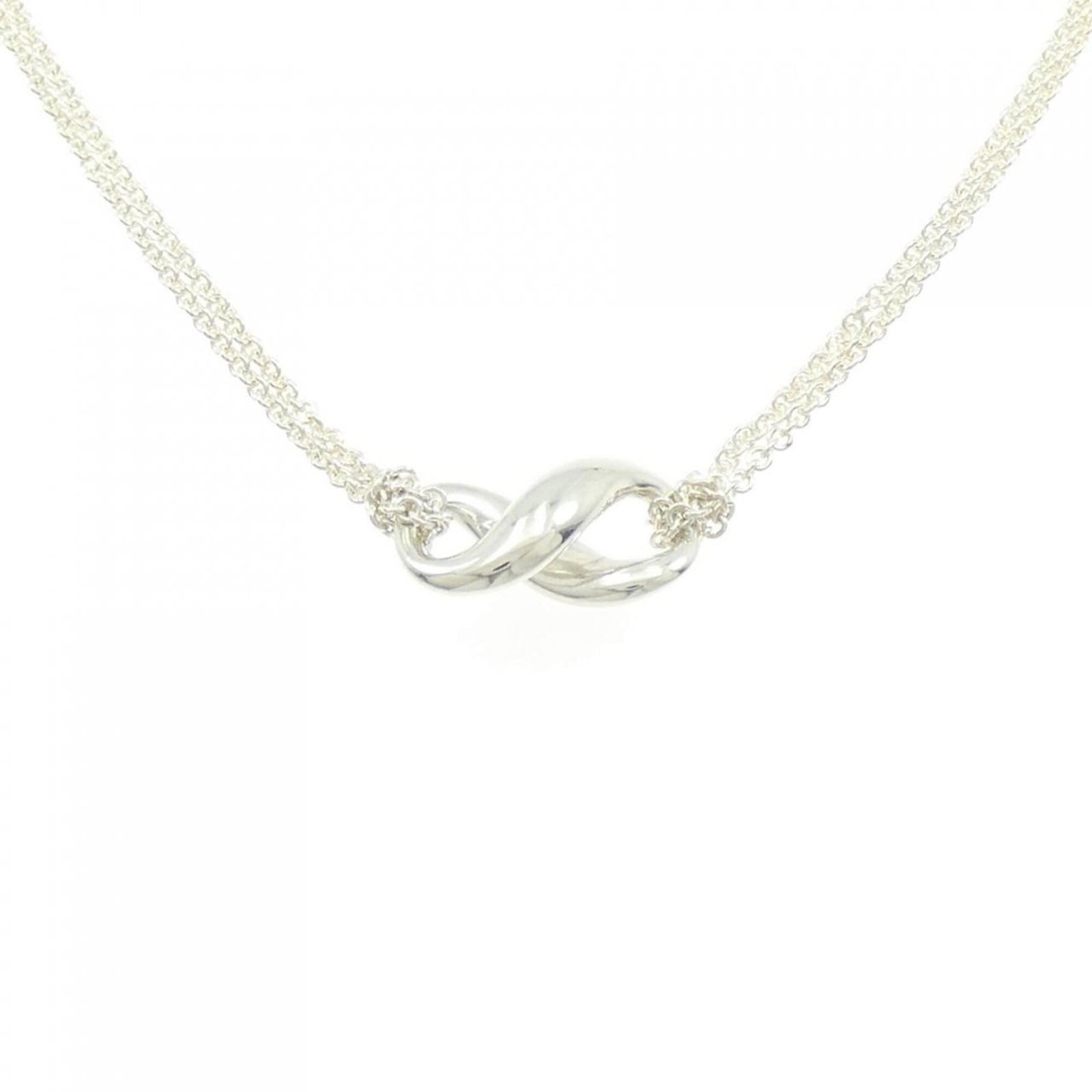 Figure Eight Necklace by Tiffany: Figure Eight Necklace by Tiffany Silver 925 Figure Eight Necklace by Tiffany, featuring a 9.1mm x 9.1mm pendant with a nice silver finish, available in a 40 cm / 15.74'' adjustable neck circumference,