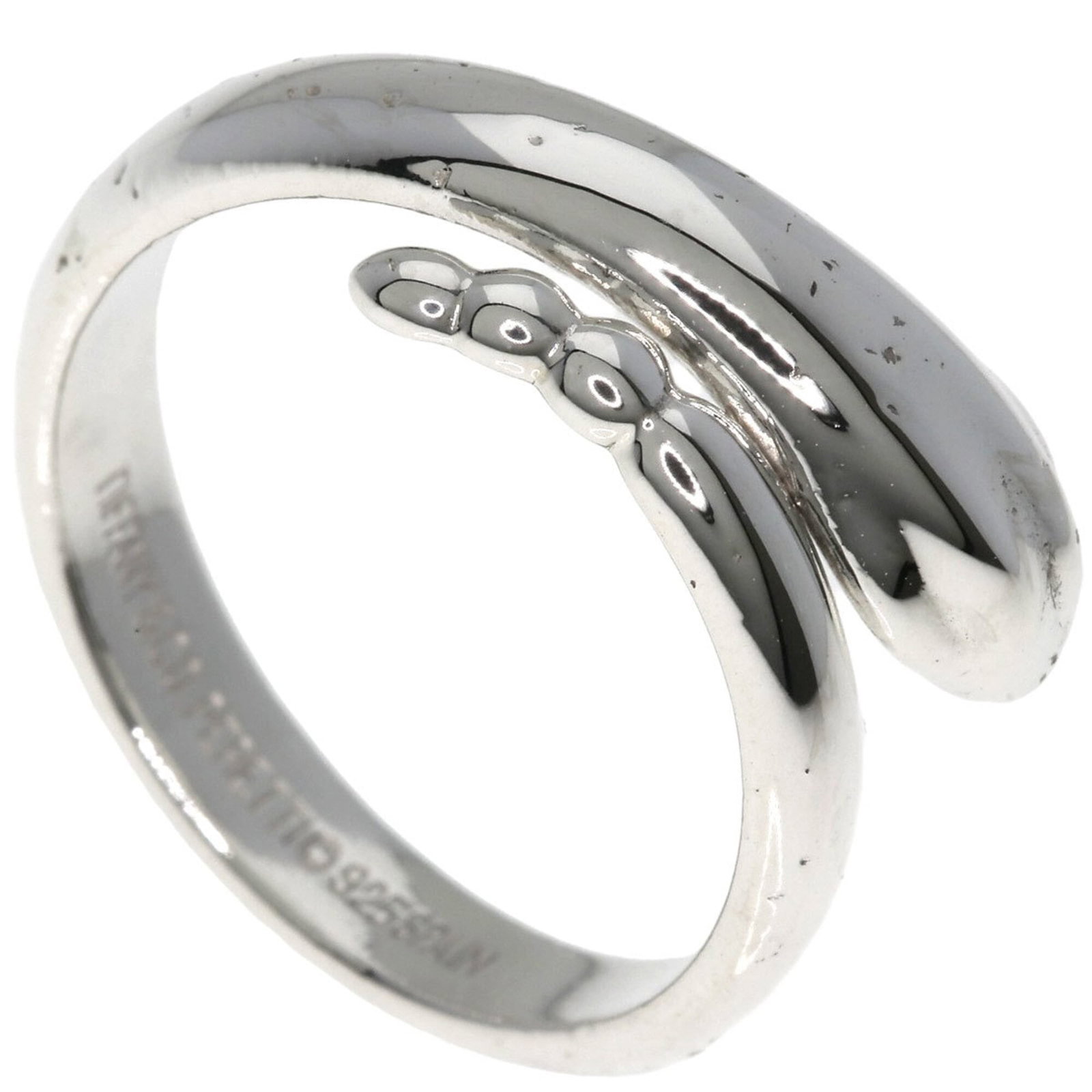 Silver Ring Tiffany Band: Silver Ring Tiffany Band Silver Ring Tiffany Band features a classic design with a silver band, suitable for everyday wear. The item bears a signature and has been used, showing traces of usage with m
