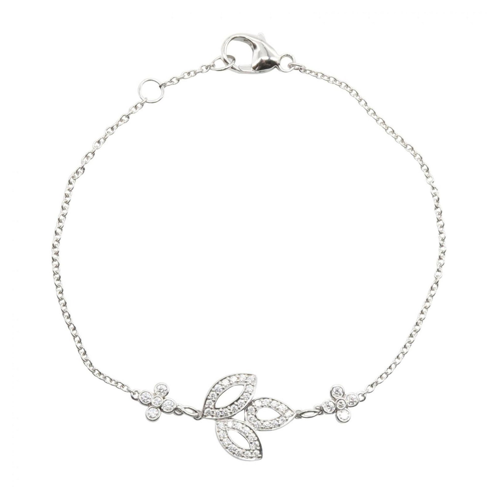 Harry Winston Platinum Charm Bracelet: Harry Winston Platinum Charm Bracelet Platinum charm bracelet from renowned jeweler Harry Winston, featuring clear and silver tones in high-quality platinum. This like-new condition piece boasts a