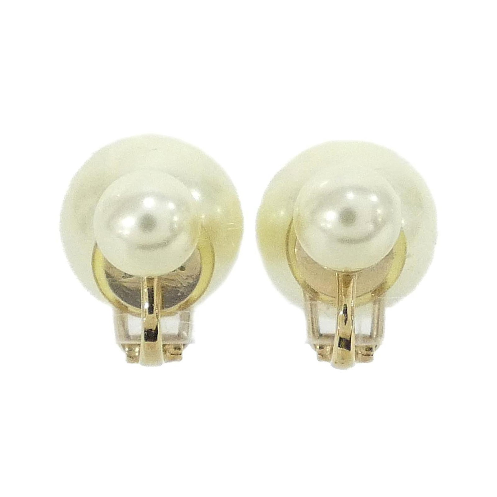 Clip earrings by Christian Dior: Clip earrings by Christian Dior Clip earrings by Christian Dior, featuring a sleek gold and white design. Made with a durable material, these clip earrings showcase the iconic brand's signature style.