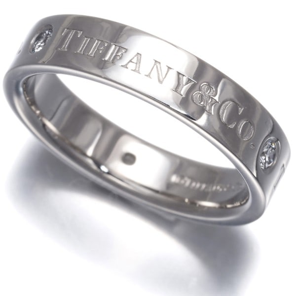 Tiffany Co Platinum 3P Diamond Band Flat 4Mm 950 Us4.75 Ring: Tiffany Co Platinum 3P Diamond Band Flat 4Mm 950 Us4.75 Ring Tiffany & Co.'s platinum flat band diamond ring boasts a stunning natural setting, showcasing a beautiful diamond in a sleek and modern des