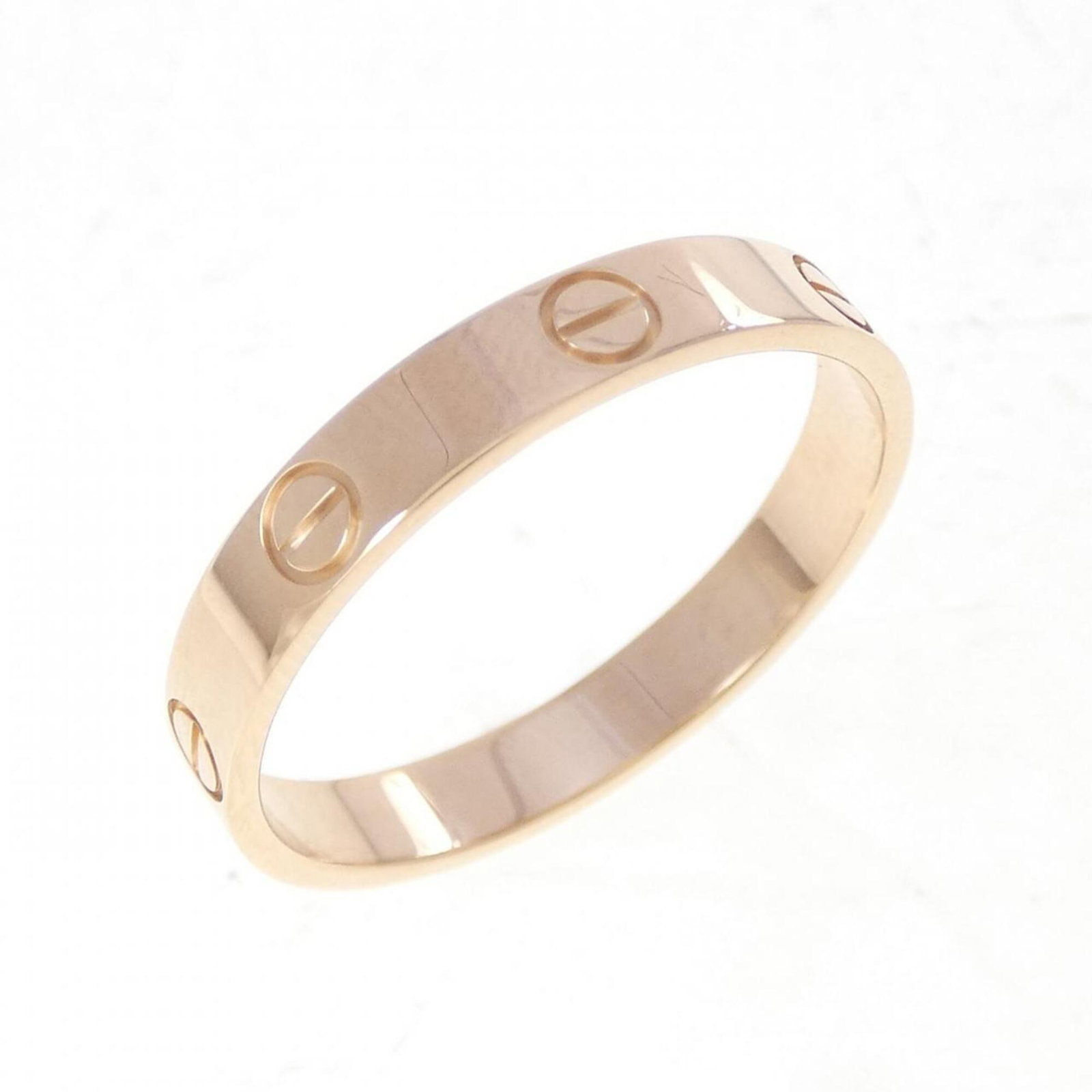 Pink gold 18k ring band from Cartier: Pink gold 18k ring band from Cartier Pink gold 18k band from Cartier, featuring a classic design with a subtle pink hue. The ring band measures 3.5mm in width and weighs 3.6g, showcasing the