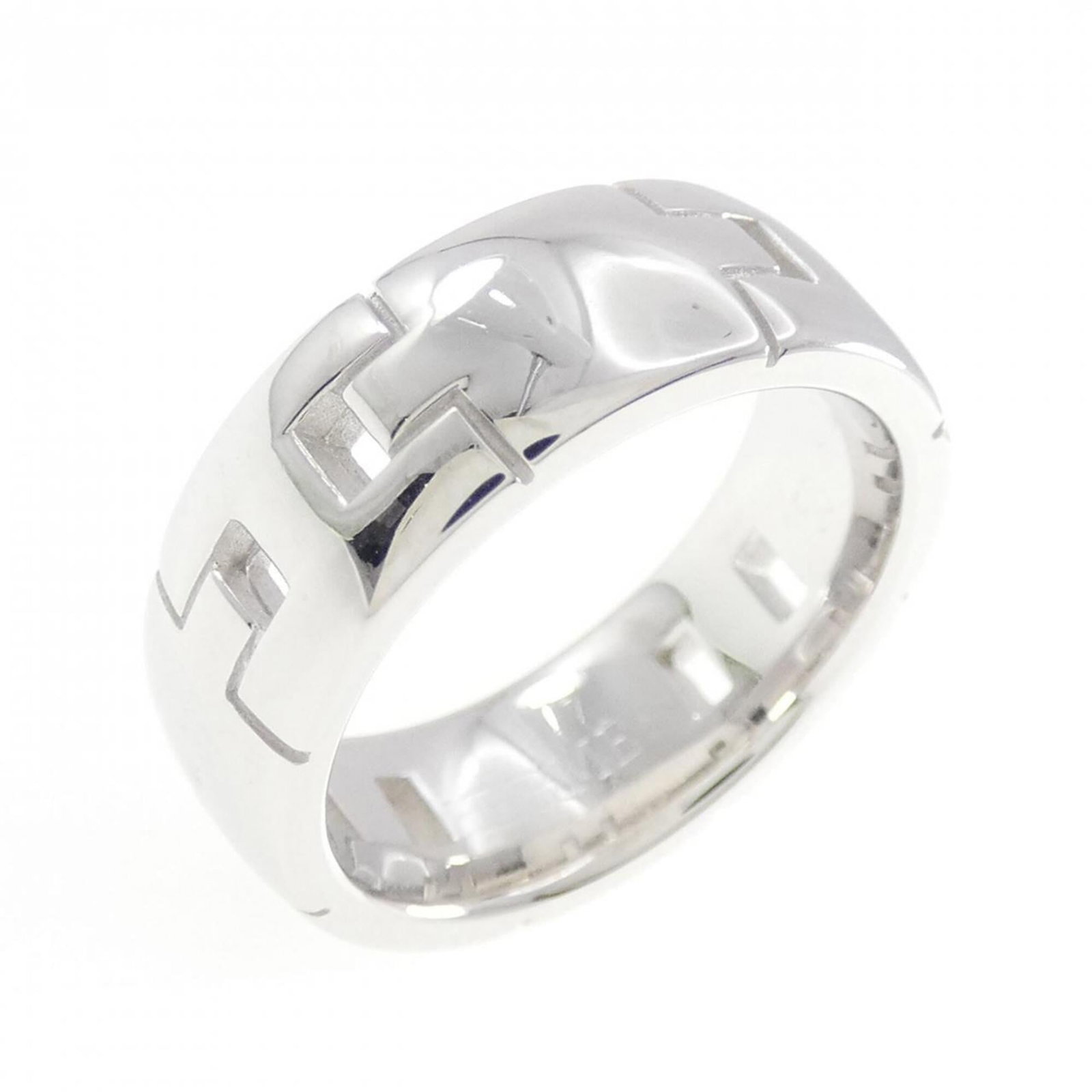 Hermes Band Ring White Gold (18K): Hermes Band Ring White Gold (18K) This Hermes Band Ring in White Gold (18K) boasts a sleek, sophisticated design. The ring features a few traces of usage, with some minor scratches and dirt visible, b