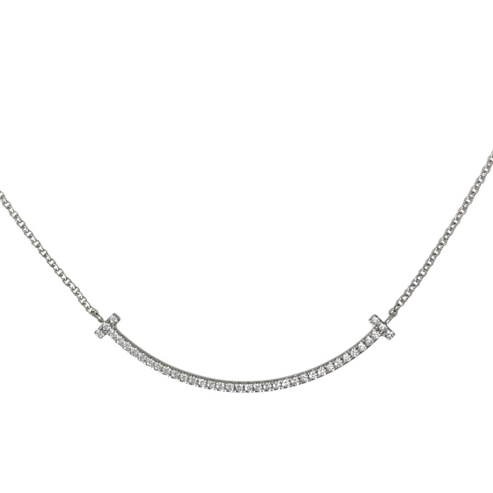 Tiffany & Co. T Smile Necklace 0.10Ct Diamond 18K White Gold 2.4G Small Women'S: Tiffany & Co. T Smile Necklace 0.10Ct Diamond 18K White Gold 2.4G Small Women'S Tiffany & Co. T Smile Necklace features a 0.10ct diamond set in 18K white gold, adding a touch of elegance to any outfit