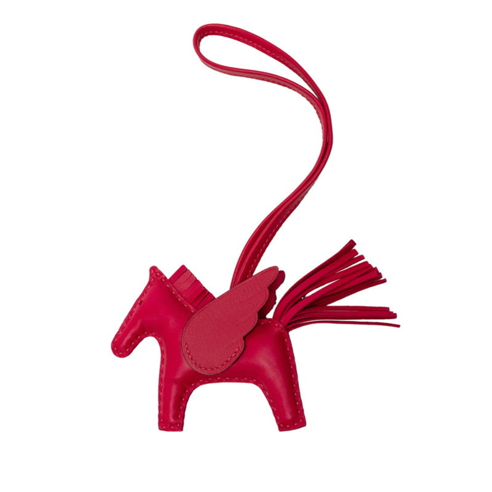 Hermes Handbag Charm Agneau Milo: Hermes Handbag Charm Agneau Milo Agneau Milo charm from Hermes, featuring a rich purple hue. This small, used handbag charm measures 7.50mm x 9.00mm and showcases some minor scratches and dirt, still 