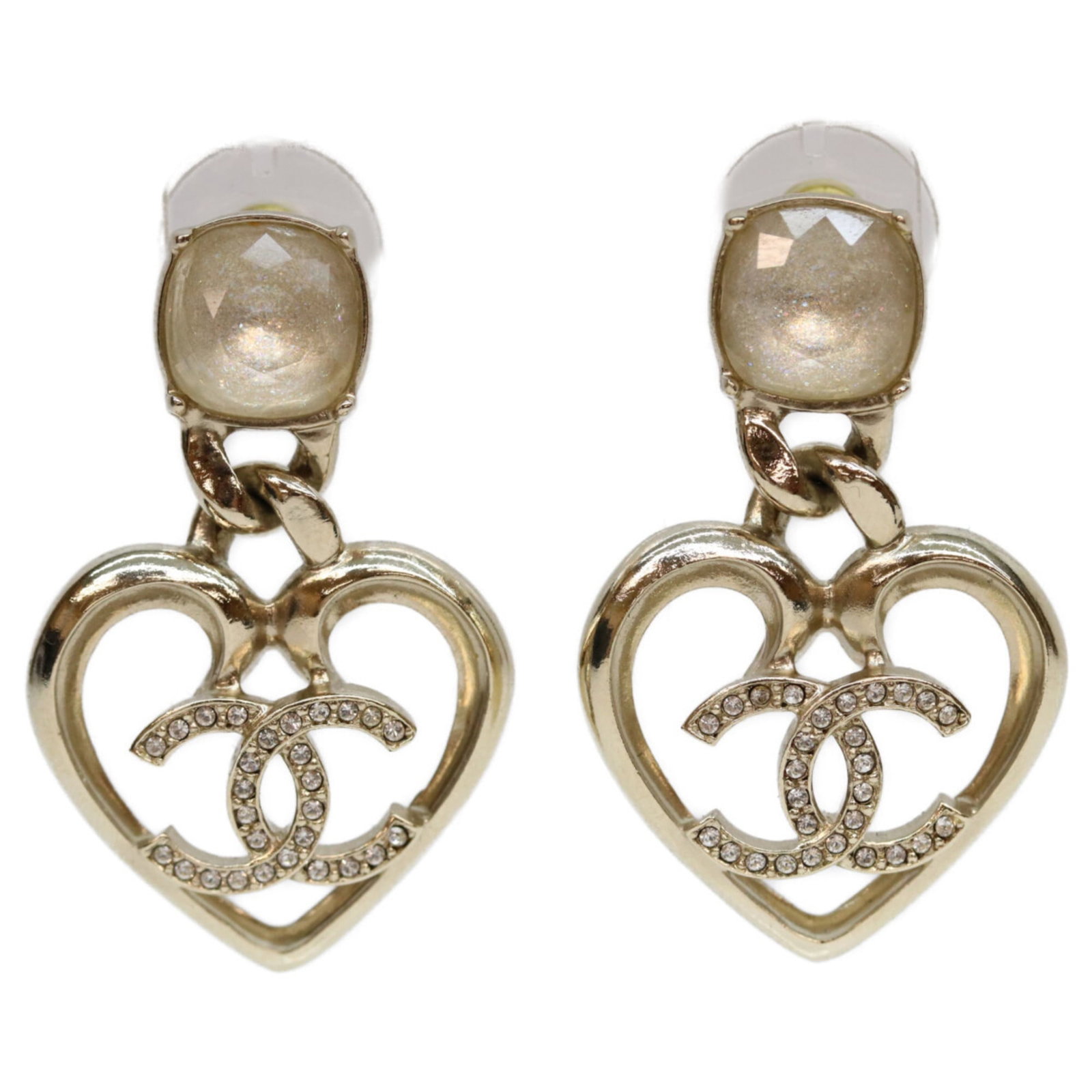 Stud Earrings Metal by Chanel: Stud Earrings Metal by Chanel Stud earrings from the iconic Chanel brand, featuring clear metal and rhinestone details. Measuring 40mm x 25mm, these earrings showcase a classic design with subtle