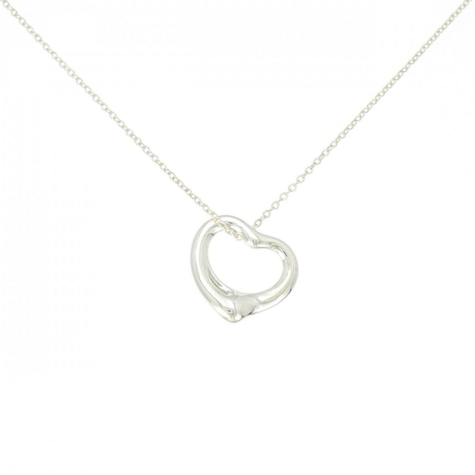Heart Open Tiffany Necklace: Heart Open Tiffany Necklace The Heart Open Tiffany Necklace is a beautiful sterling silver pendant featuring intricate details, with a subtle heart-shaped design. Its delicate size and elegant style m