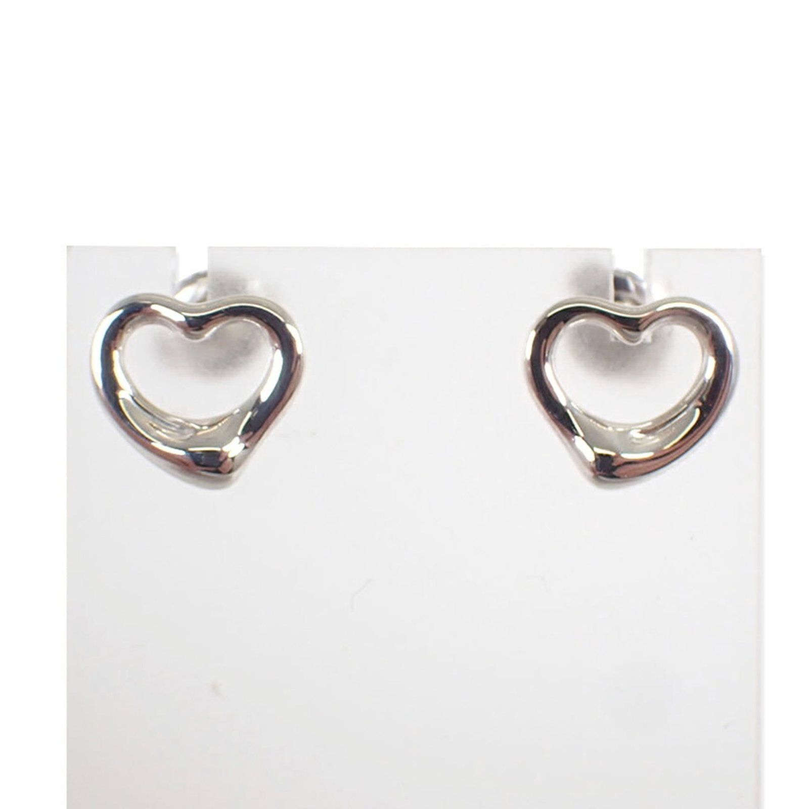 Sterling Silver Stud Earrings by Tiffany: Sterling Silver Stud Earrings by Tiffany Sterling Silver Stud Earrings by Tiffany are crafted from high-quality 925 sterling silver, offering a sleek and sophisticated design. The earrings feature a
