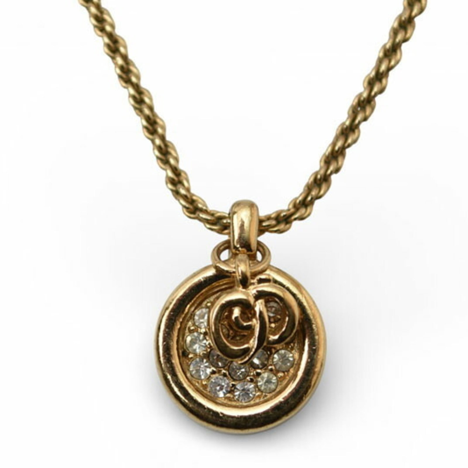 Christian Dior Necklace Circle Gold Rhinestones With: Christian Dior Necklace Circle Gold Rhinestones With Gold Circle Rhinestones Necklace from Christian Dior features a striking gold plating design with intricate details. The necklace boasts a classic 