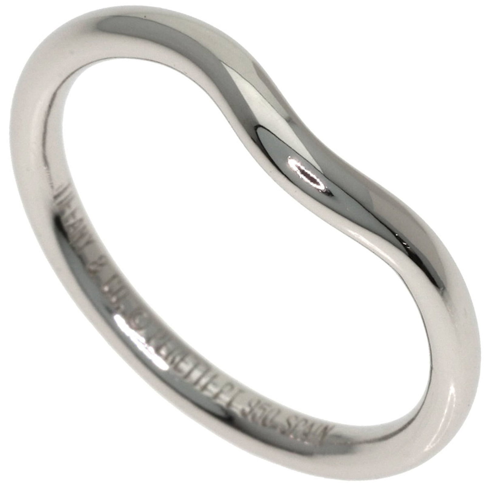 Platinum ring by Tiffany band: Platinum ring by Tiffany band Platinum ring by Tiffany features a classic band design made from high-quality platinum. The item has some minor signs of wear, including faint scratches and dirt, but
