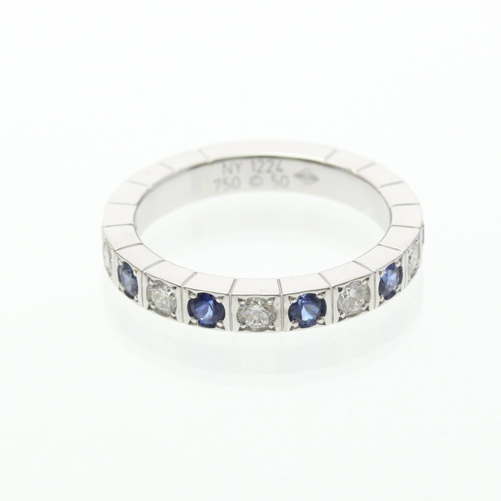 White Gold Cartier Band Ring 18K: White Gold Cartier Band Ring 18K White Gold Cartier Band Ring 18K - A Timeless Fashion Statement. This elegant 18K white gold band ring features a diamond and sapphire stone, showcasing the signature