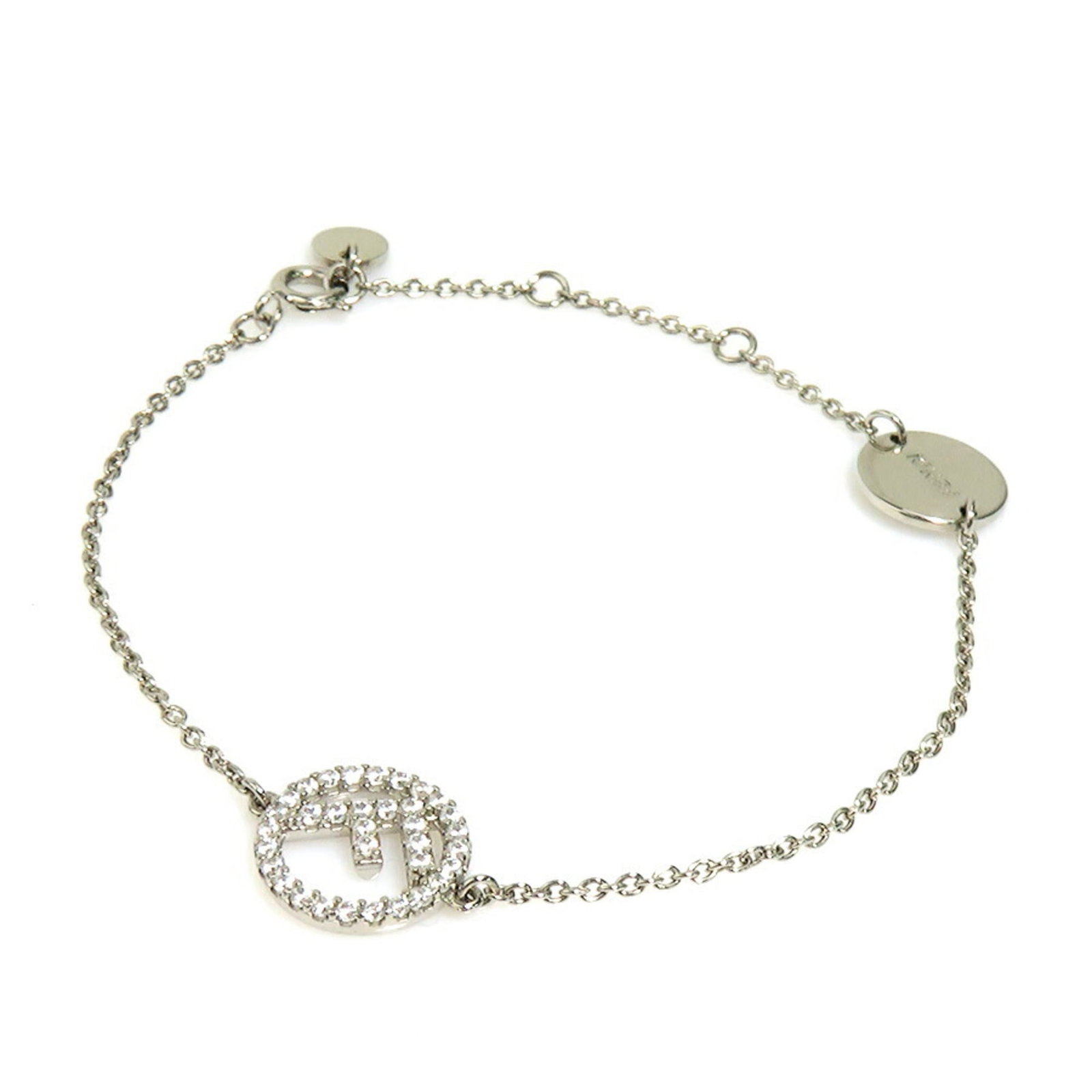 Metal Charm Fendi bracelet: Metal Charm Fendi bracelet Metal charm Fendi bracelet features a rhinestone stone and measures 20.8cm in total length, slightly longer than its 19.5cm metal charm portion. The item has traces of