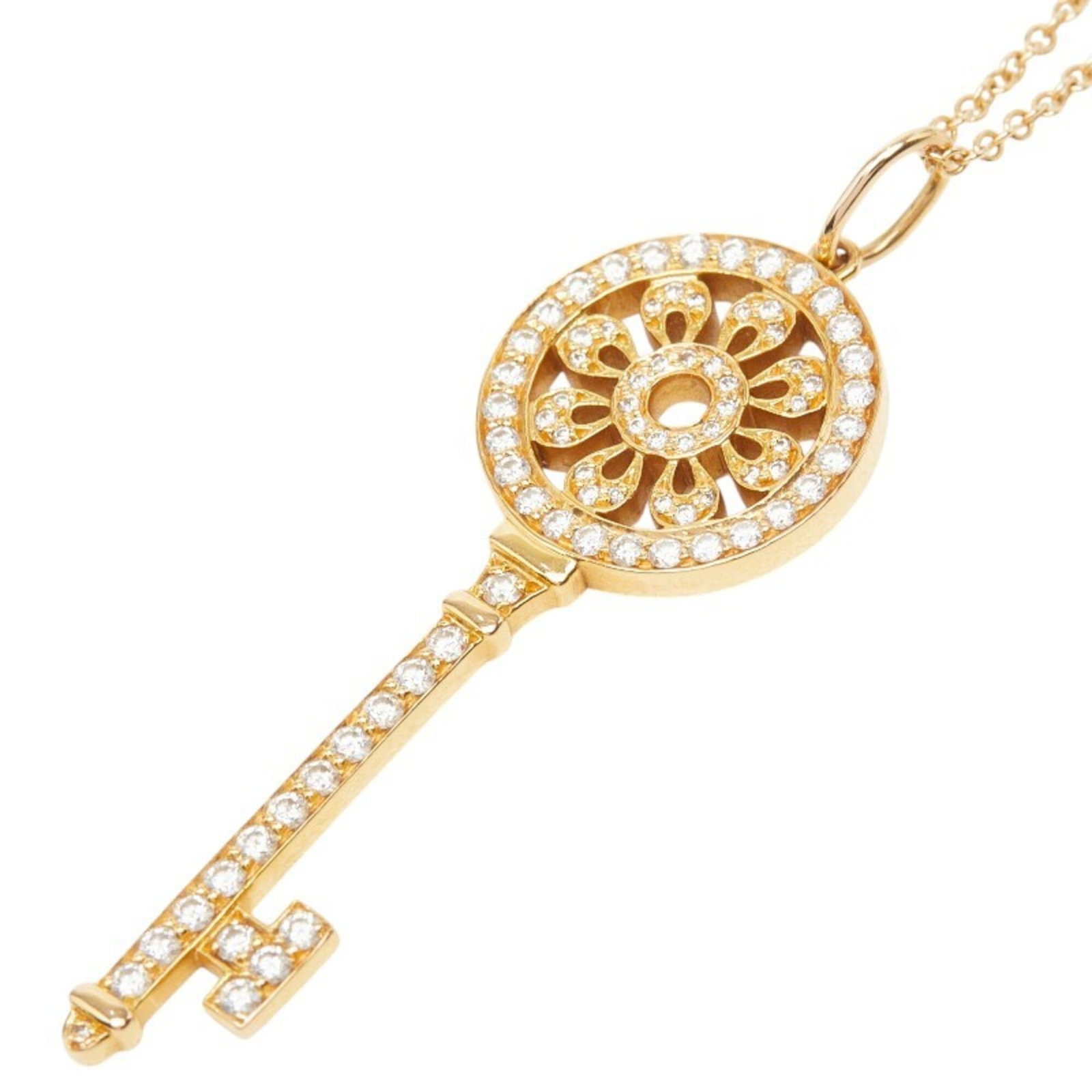 Tiffany & Co. 18K Yellow Gold Diamond Petal Key Medium Necklace For Women: Tiffany & Co. 18K Yellow Gold Diamond Petal Key Medium Necklace For Women Tiffany & Co.'s iconic diamond petal key necklace shines in 18K yellow gold, its delicate design featuring a medium pendant