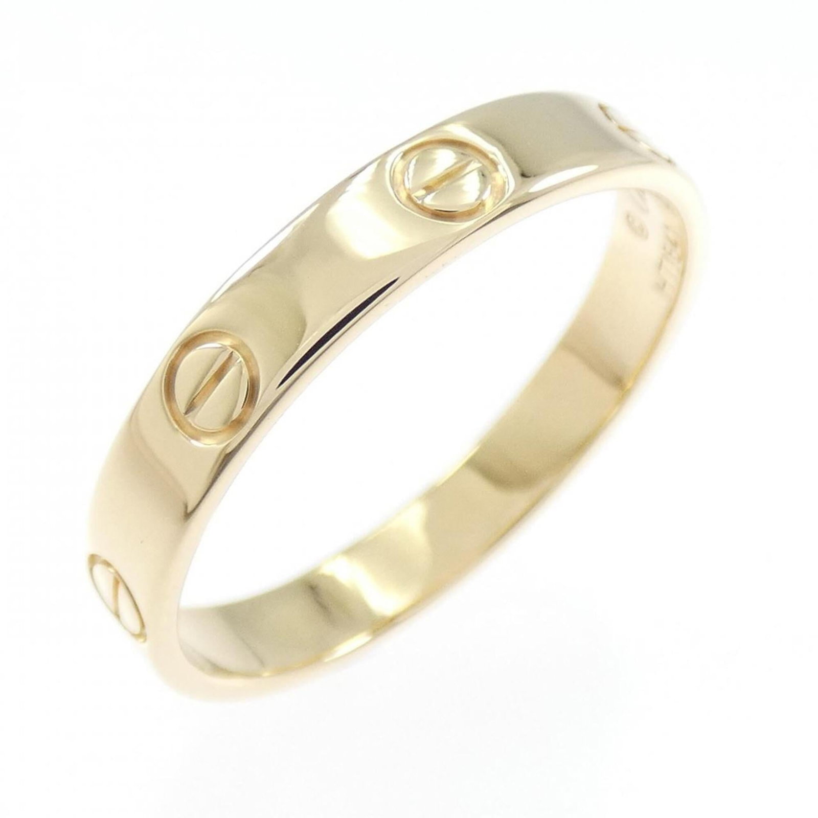 Yellow Gold Ring 18K Cartier: Yellow Gold Ring 18K Cartier Yellow Gold Ring 18K Cartier features an 18k yellow gold band, bearing the iconic Cartier brand. The ring has been worn and shows a few traces of usage, with some minor
