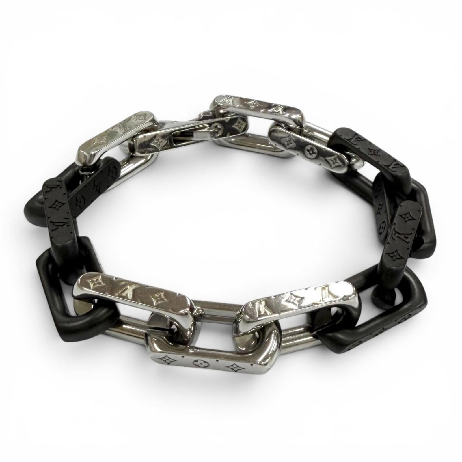 Vuitton Louis Charm Bracelet: Vuitton Louis Charm Bracelet The Louis Vuitton Louis Charm Bracelet boasts a sleek, black design with subtle silver accents. With its classic charm style and durable construction, this bracelet makes