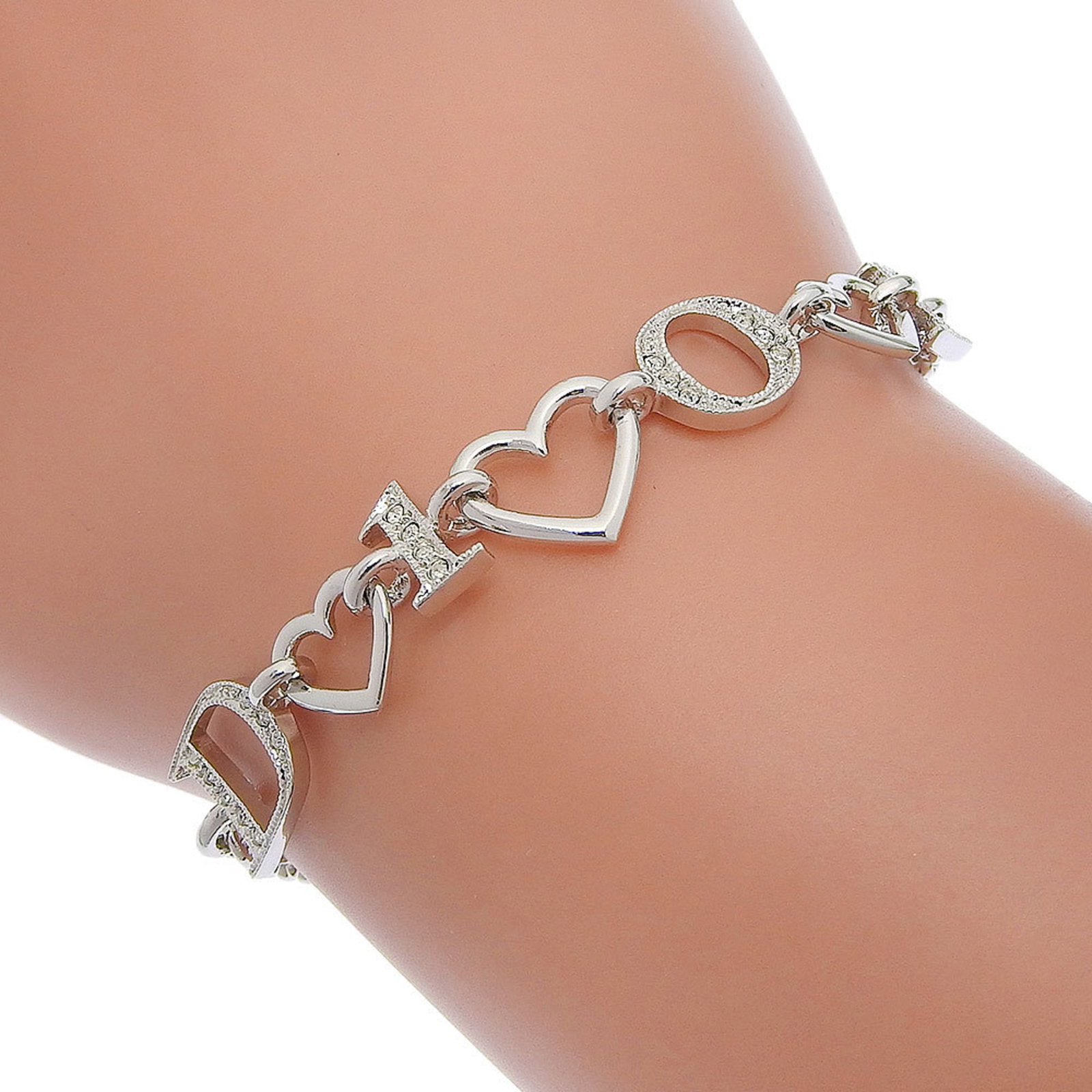 Metal Charm Christian Dior: Metal Charm Christian Dior Silver Metal Charm from Christian Dior features a rhinestone stone. The charm bracelet measures 20cm in length and has some minor scratches and dirt, but remains in very goo