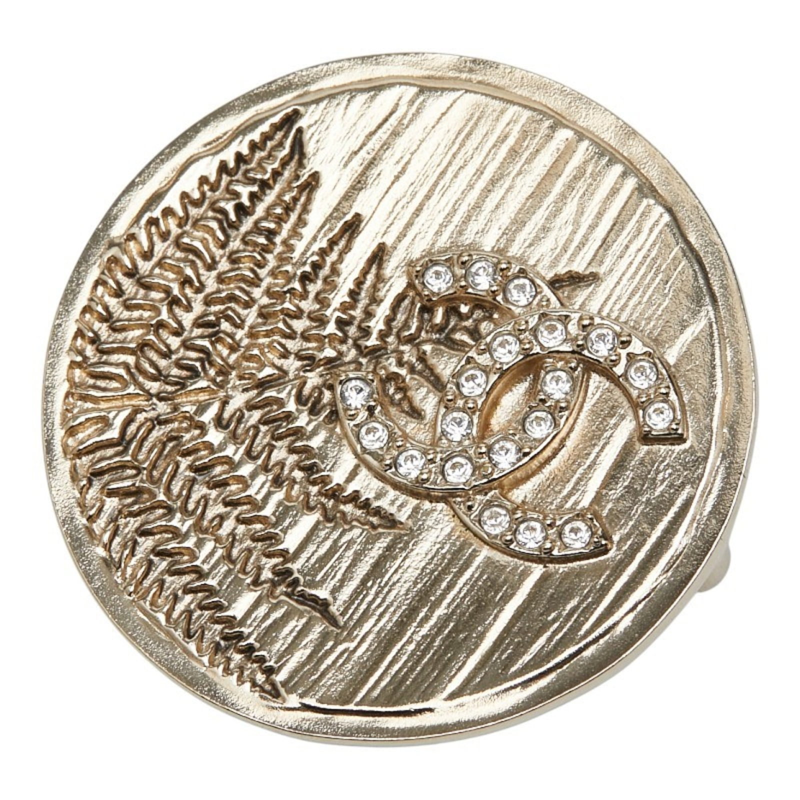 Chanel Brooch: Chanel Brooch Gold Rhinestone Chanel Brooch, 3.95cm x 3.95cm / 1.55'' x 1.55''This gold rhinestone brooch from Chanel boasts a striking design, featuring a prominent stone set against a luxurious