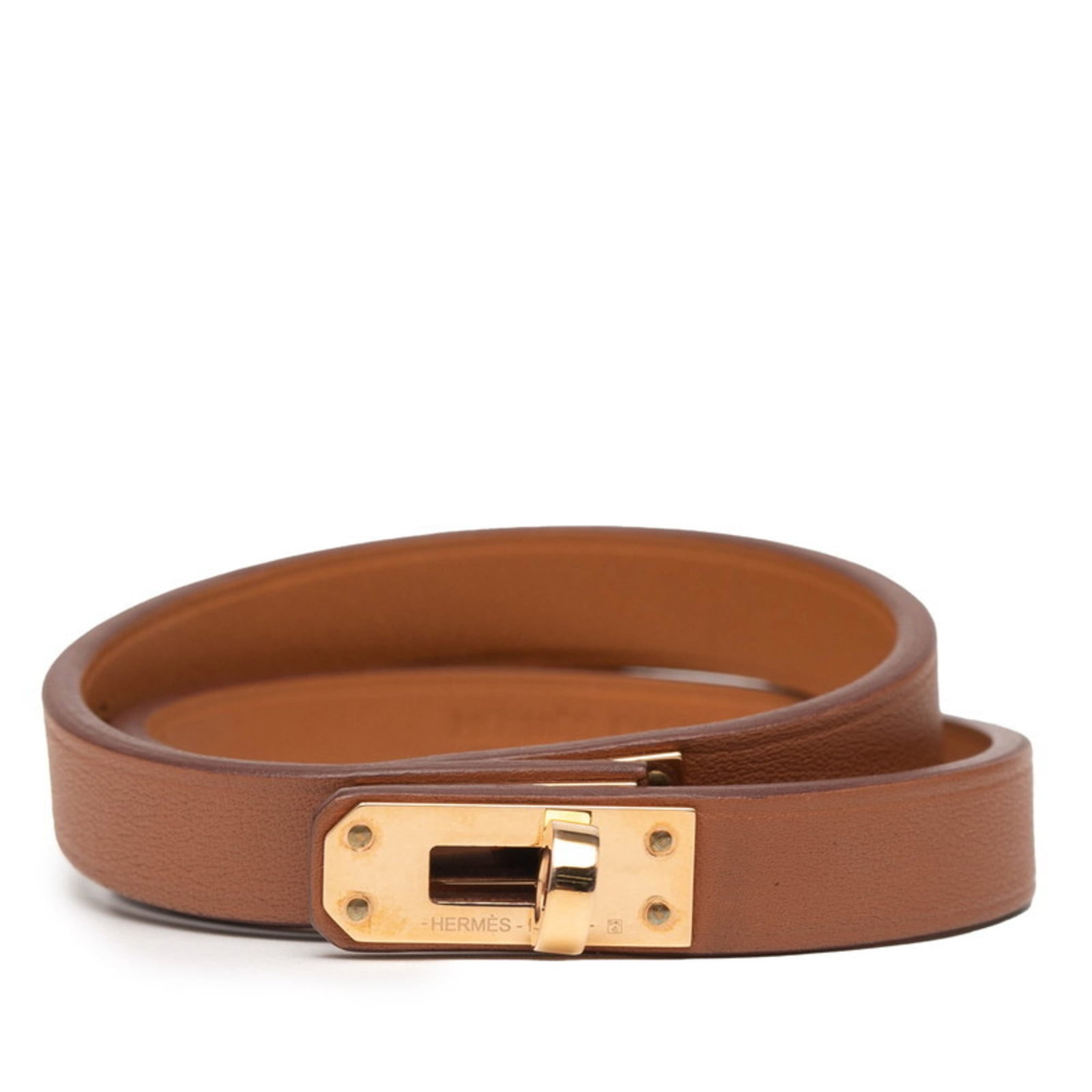 Hermes Leather Charm Swift Bracelet: Hermes Leather Charm Swift Bracelet Swift Leather Charm Bracelet in Brown, featuring the iconic Hermes design. Made from high-quality Swift Leather, this 14cm / 5.51'' charm bracelet boasts a timeless