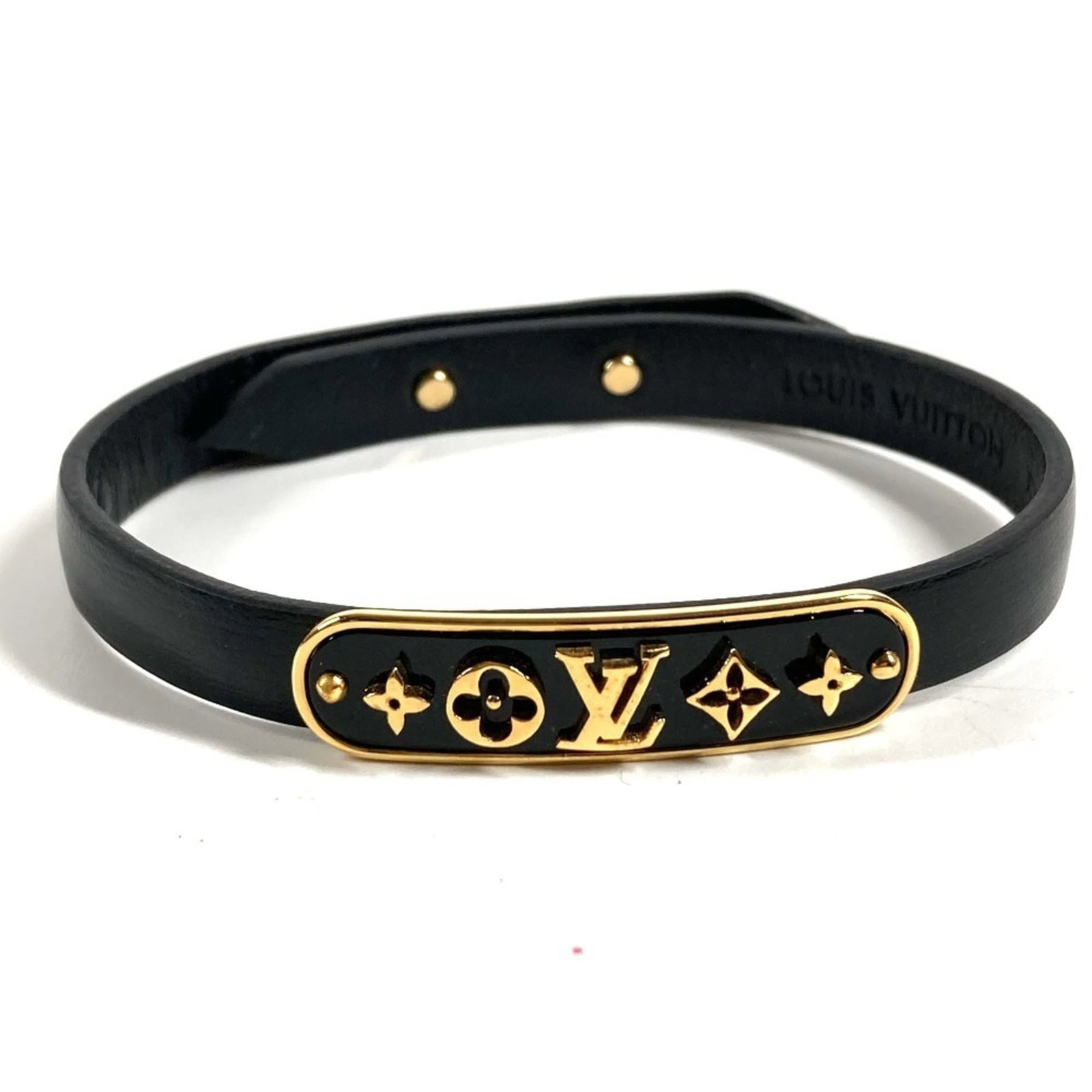 Louis Vuitton Bangle Leather: Louis Vuitton Bangle Leather Used Louis Vuitton Bangle Leather, featuring a high-quality leather material with some scratches and dirt. The bangle bears a signature, but its origin cannot be confirmed