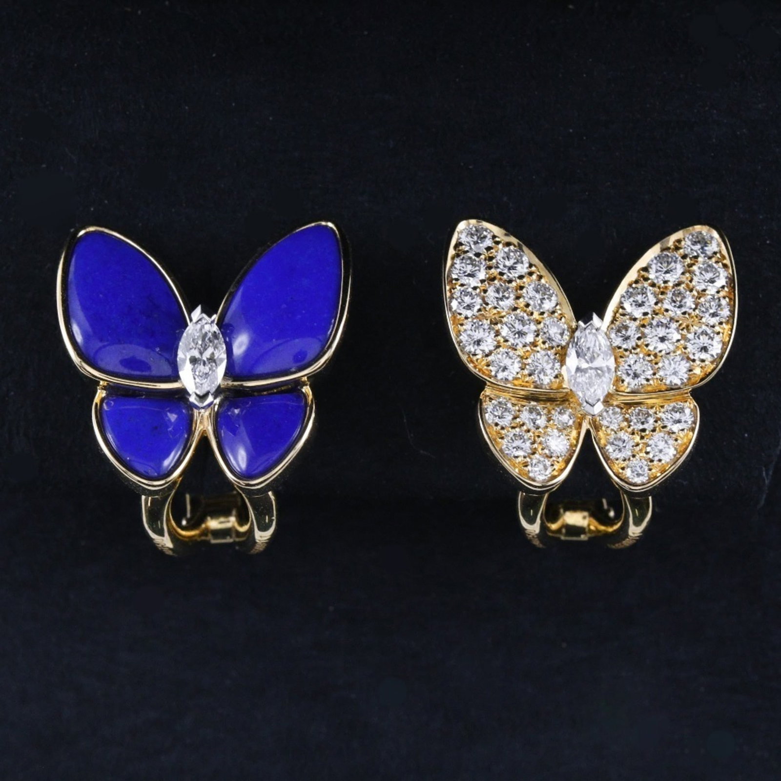 Clip earrings in yellow gold from Van Cleef & Arpels: Clip earrings in yellow gold from Van Cleef & Arpels Yellow gold clip earrings from Van Cleef & Arpels feature a striking diamond and lapis lazuli design, showcasing the beauty of these precious