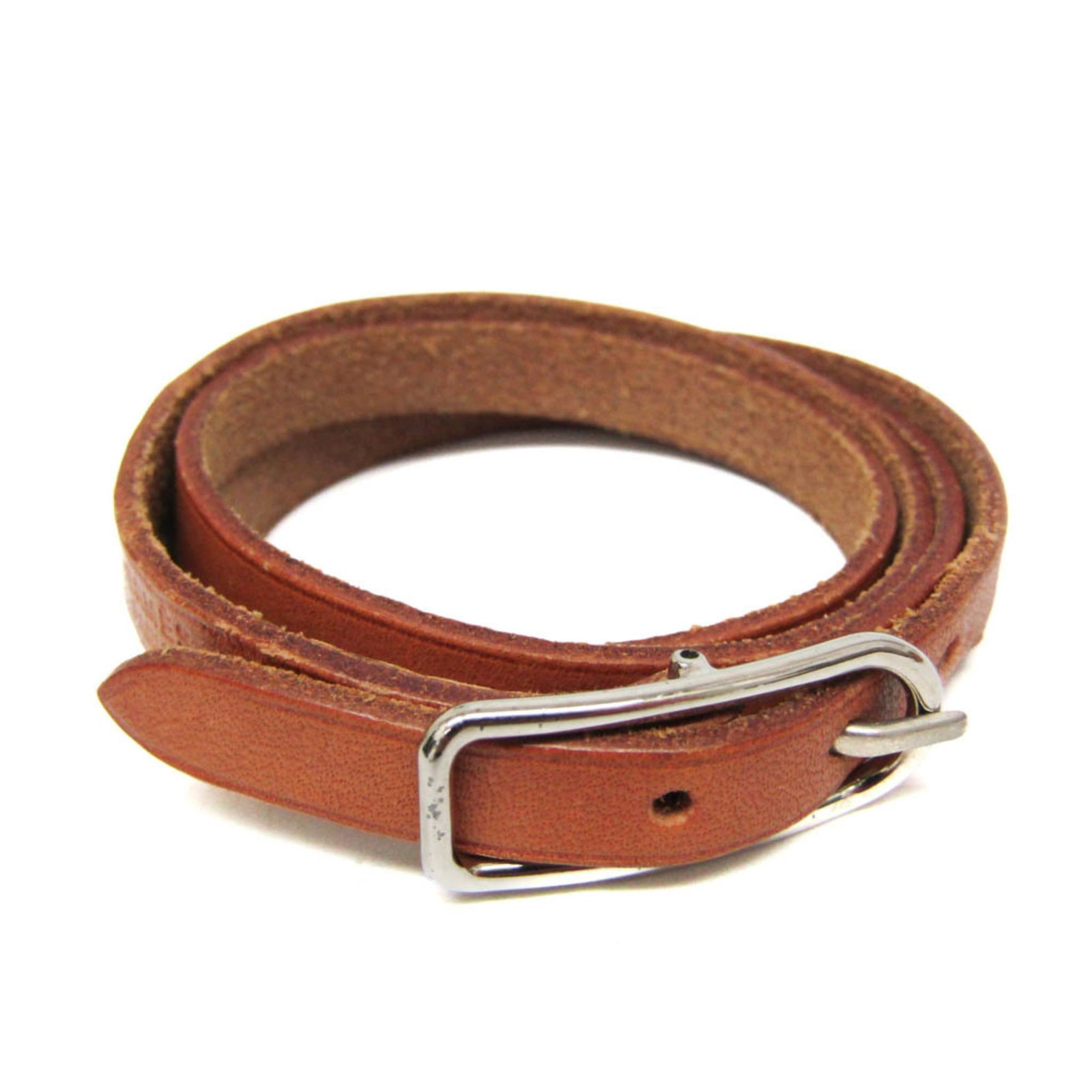 Metal leather bangle Hermes: Metal leather bangle Hermes This metal leather bangle from Hermes features a rich brown and silver design, with a subtle width of 7mm. Made from high-quality materials, the bangle measures