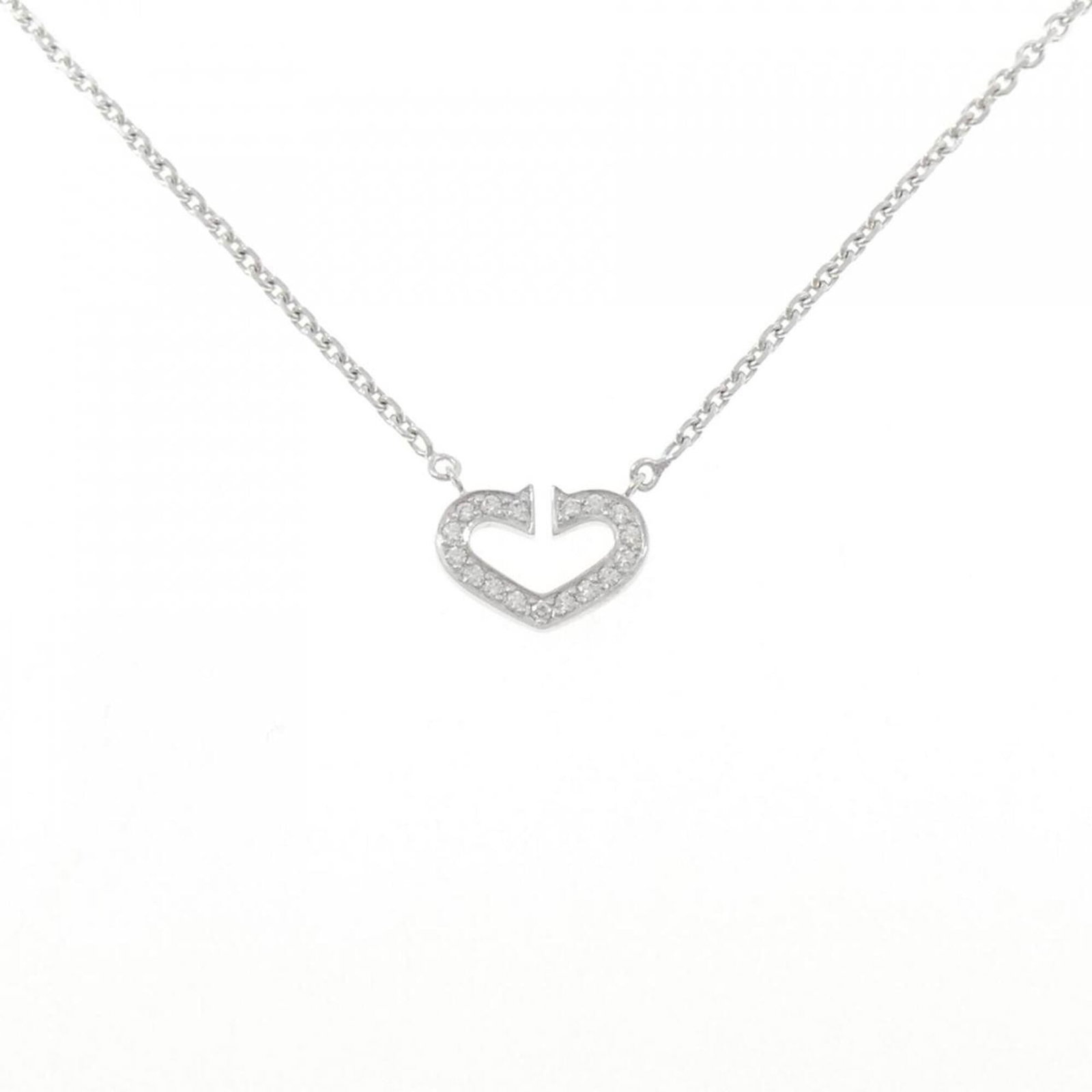 Heart Necklace from Cartier: Heart Necklace from Cartier White gold (18K) Cartier necklace featuring a beautiful diamond pendant, crafted with attention to detail. The necklace boasts a classic design and elegant look, making it 
