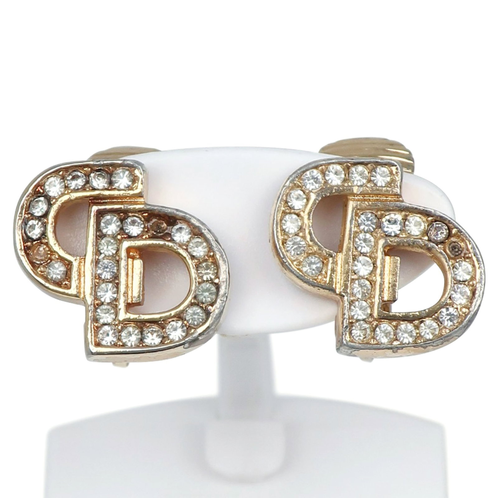 Christian Dior Clip Earrings Gold Plating: Christian Dior Clip Earrings Gold Plating Gold Plating Clip Earrings from Christian Dior feature intricate details and shine with rhinestone accents, adding a touch of luxury to any outfit. Made from