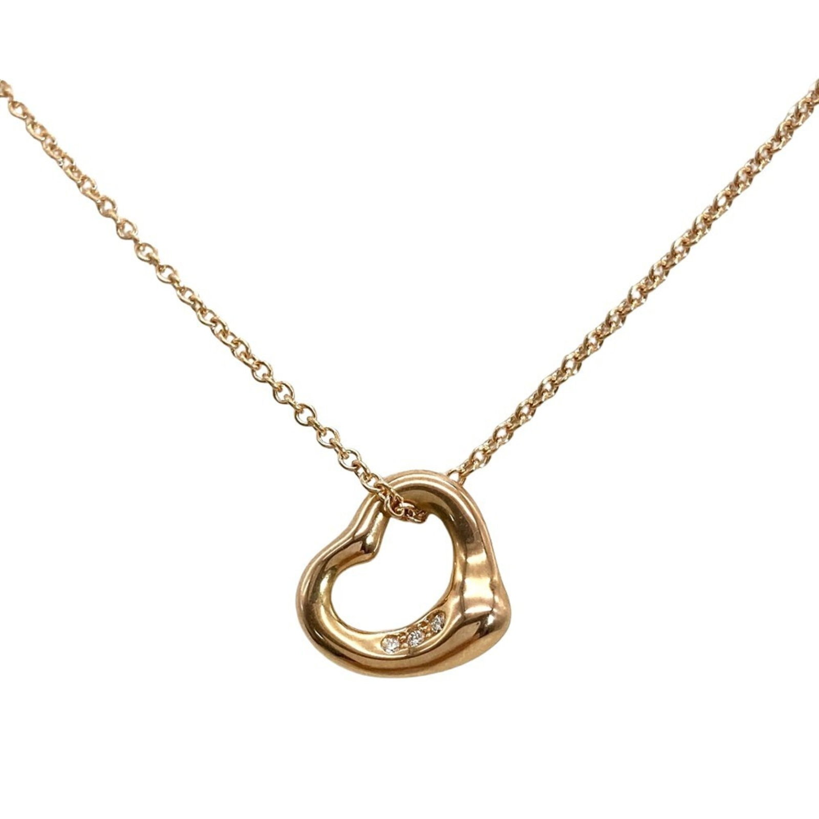 Tiffany & Co. Open Heart Necklace With Diamonds 18K Pink Gold (3.0G) Designed By Elsa Peretti For: Tiffany & Co. Open Heart Necklace With Diamonds 18K Pink Gold (3.0G) Designed By Elsa Peretti For 18K pink gold necklace with an open heart pendant, designed by Elsa Peretti for Tiffany & Co., feature