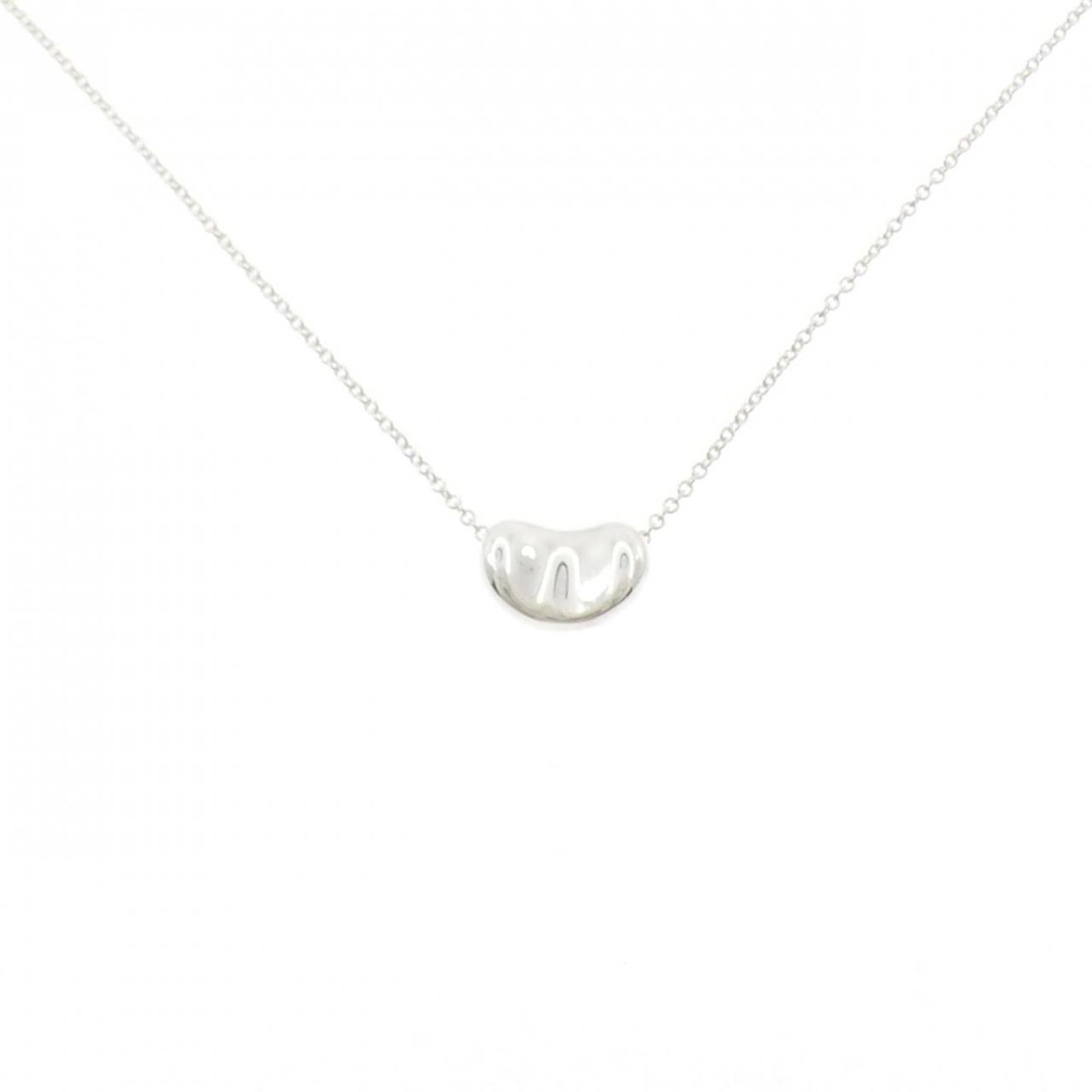 Tiffany Beans Necklace: Tiffany Beans Necklace The Tiffany Beans Necklace boasts a sleek silver design, measuring 7.5mm x 11.2mm, suspended from a 41 cm chain circumference. This sterling silver pendant features a subtle