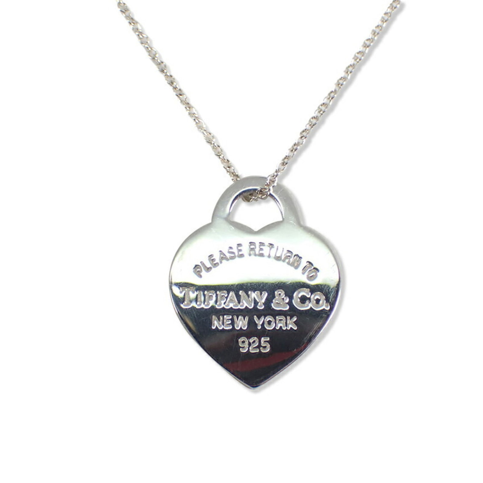 925 Return to Tiffany Heart Necklace Tag: 925 Return to Tiffany Heart Necklace Tag Sterling silver necklace tag with intricate design, bearing the iconic Return to Tiffany logo. Made from high-quality 925 material, this delicate pendant
