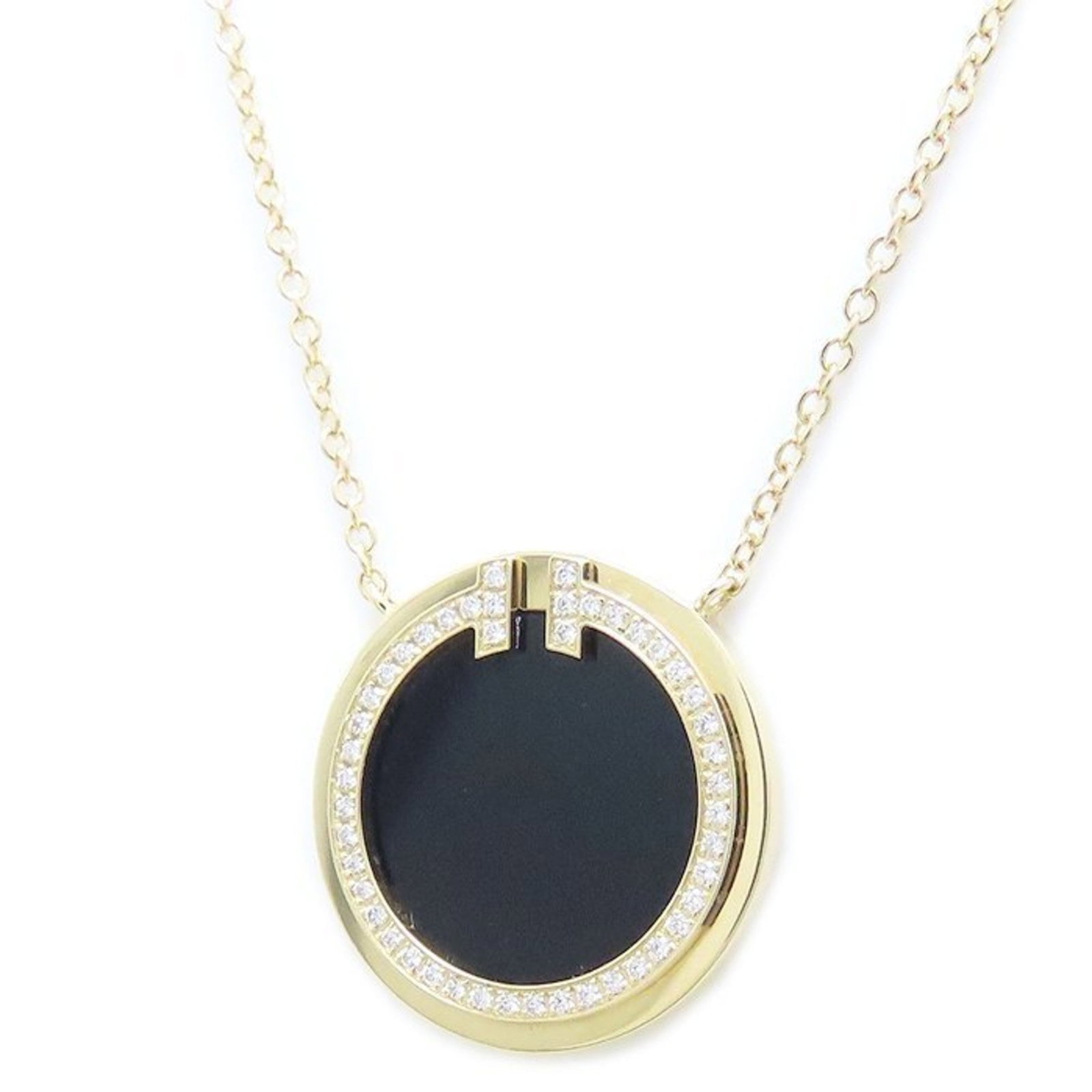 Tiffany T Circle Necklace Onyx Diamonds 18K Yellow Gold For Women: Tiffany T Circle Necklace Onyx Diamonds 18K Yellow Gold For Women 18K yellow gold pendant features an onyx stone surrounded by diamonds, crafted in the iconic Tiffany & Co. style. The necklace boasts 