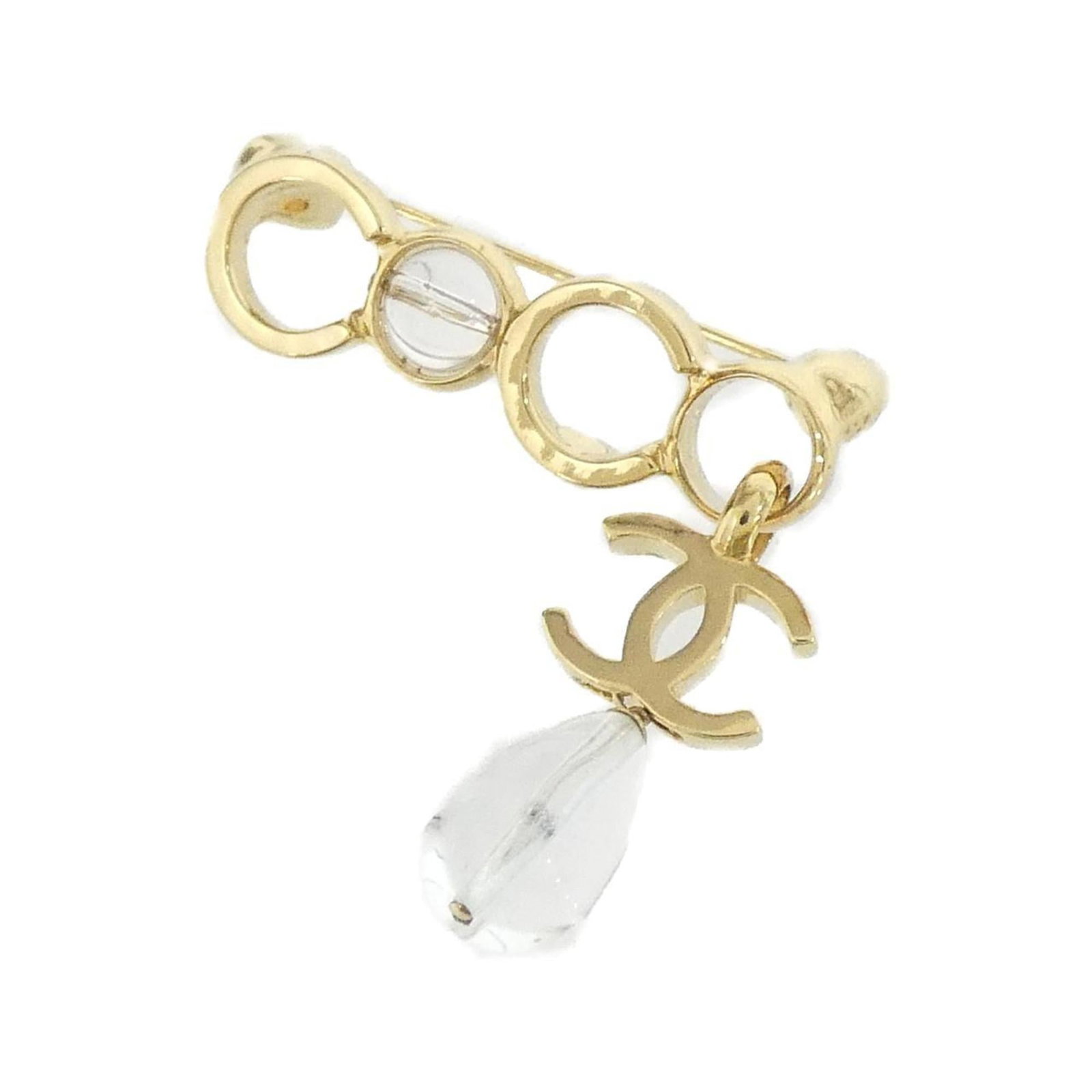 Chanel Brooch: Chanel Brooch Clear, gold Chanel brooch with a subtle sheen, measuring 4cm x 4cm. Bares some minor signs of wear, including scratches and faint dirt marks, but remains in very good condition overall. 