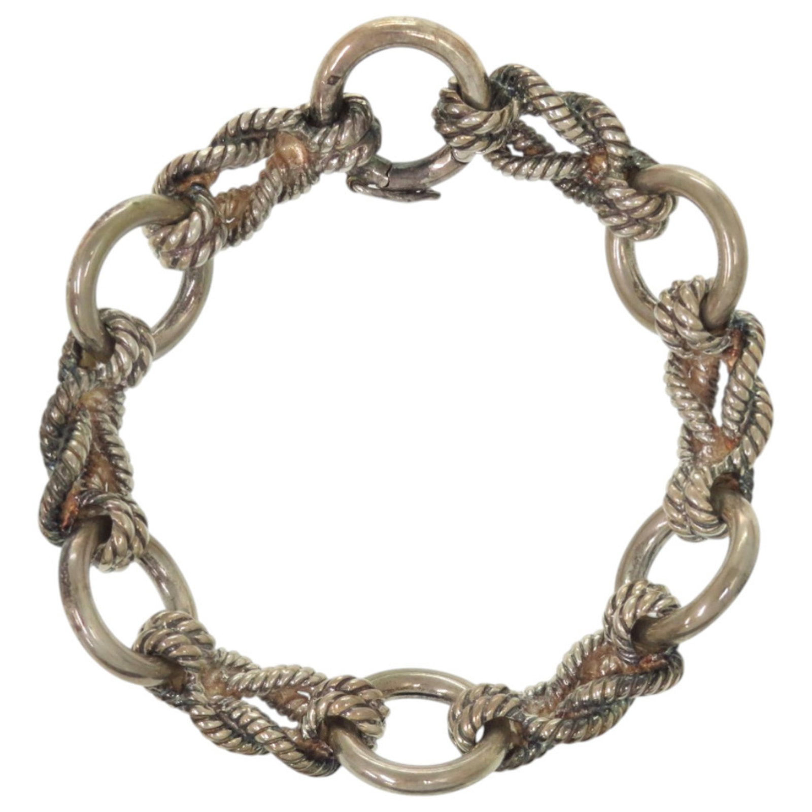 Silver Charm Bracelet 925 by Hermes: Silver Charm Bracelet 925 by Hermes Silver Charm Bracelet 925 by Hermes, featuring a classic design with subtle wear from past use. The bracelet measures 18cm in length and showcases a silver finish w