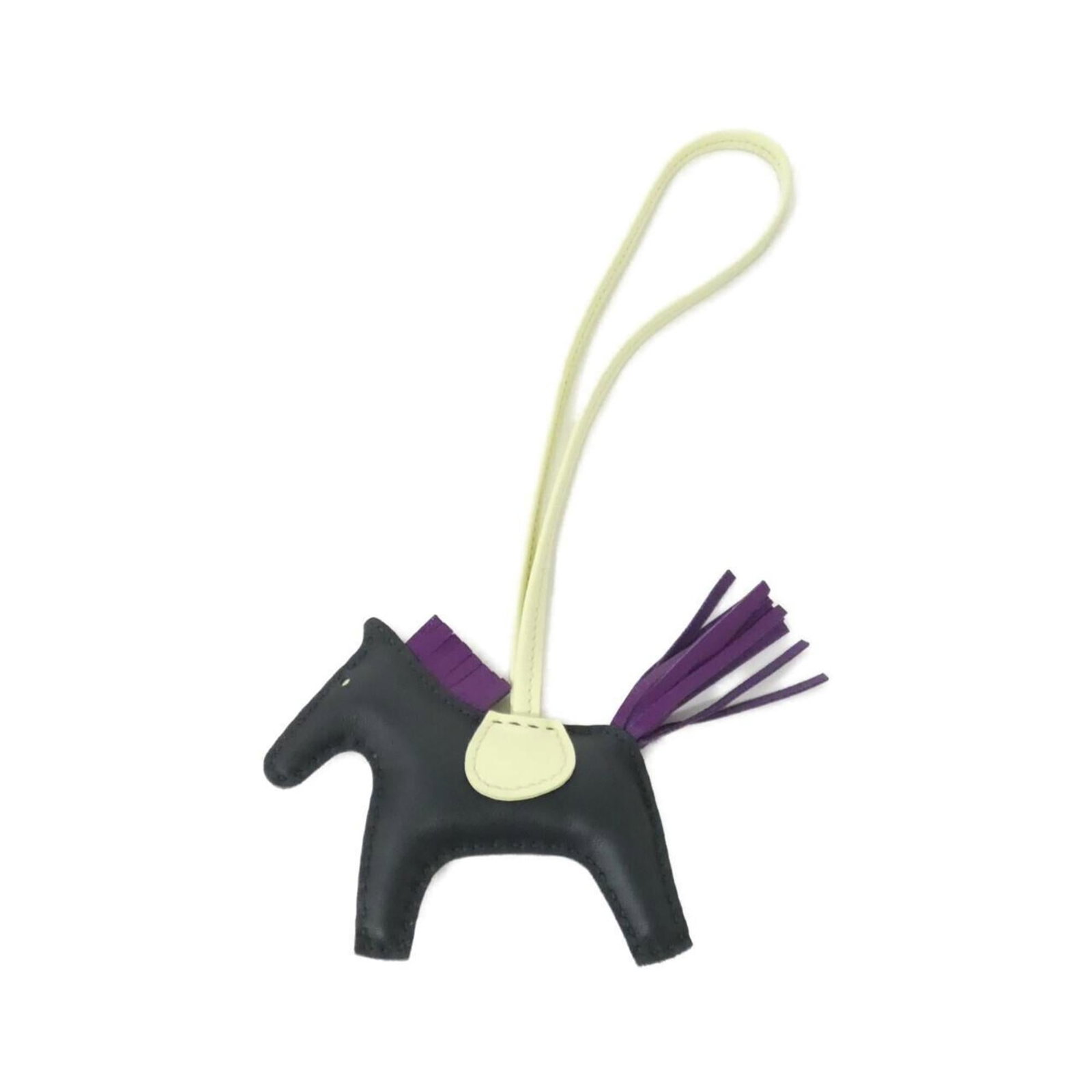 Hermes Handbag Charm Agneau Milo: Hermes Handbag Charm Agneau Milo Agneau Milo, the iconic material from Herm?s, gives this charm its distinctive sheen. The subtle green, yellow, and violet hues add a touch of elegance to this small