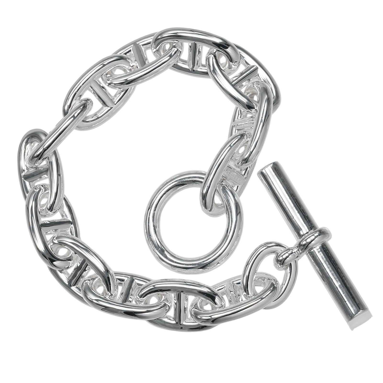 Silver Charm Bracelet 925 by Hermes: Silver Charm Bracelet 925 by Hermes Silver Charm Bracelet 925 by Hermes - A Timeless Accessory. Made from high-quality silver 925, this charm bracelet features a sleek design and measures 19.5cm in