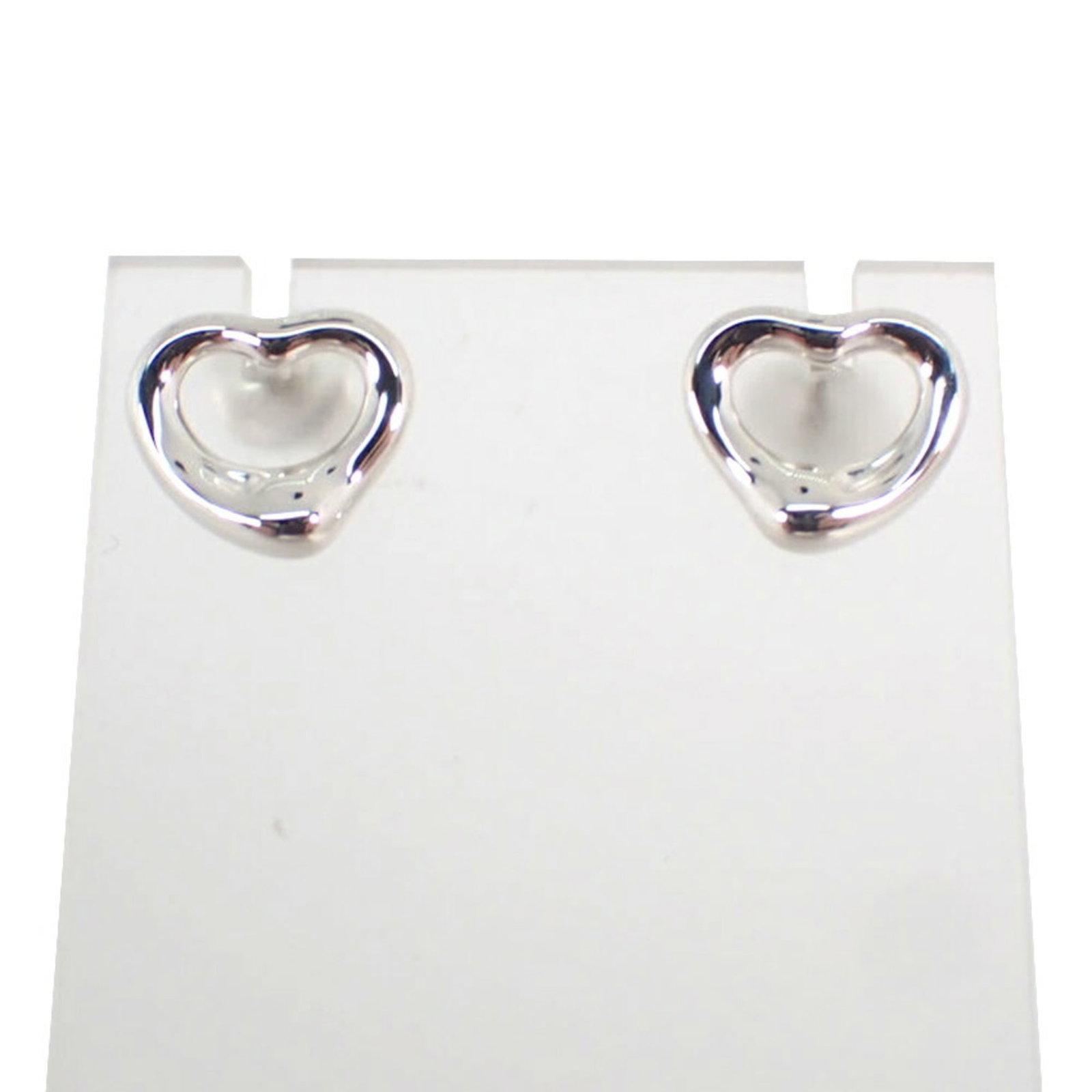 Sterling Silver Stud Earrings by Tiffany: Sterling Silver Stud Earrings by Tiffany Sterling silver stud earrings by Tiffany, crafted with 925 quality, feature a sleek and modern design. These elegant earrings measure 9.70mm x 10.90mm and are 