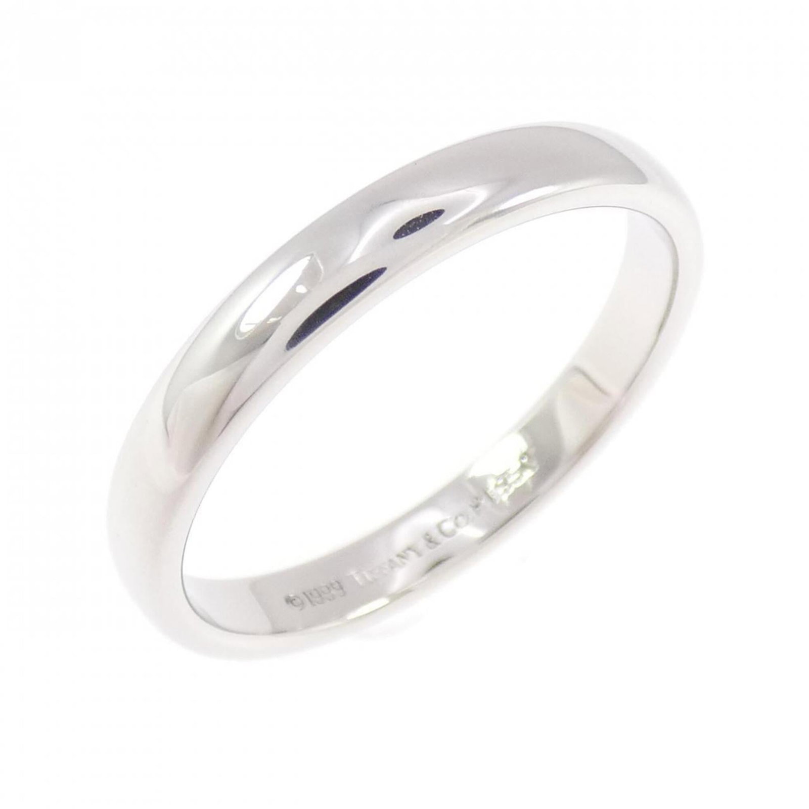 Platinum ring by Tiffany band: Platinum ring by Tiffany band Platinum ring by Tiffany & Co. features a band design made from 950 platinum, a durable and luxurious metal. This used ring shows some signs of wear, with minor scratches