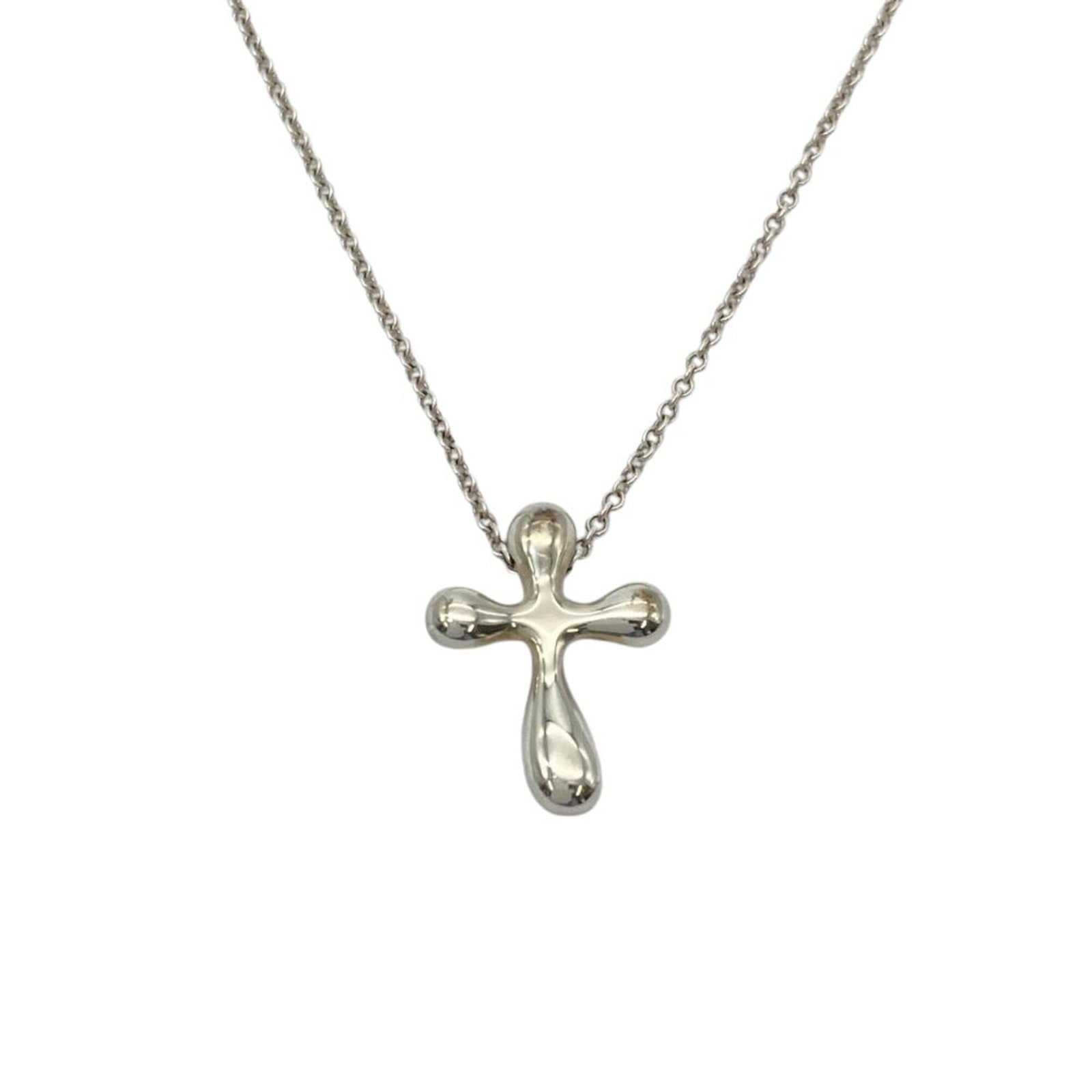 Tiffany & Co. Small Cross Necklace Sv925 2.9G Silver By Elsa Peretti: Tiffany & Co. Small Cross Necklace Sv925 2.9G Silver By Elsa Peretti Tiffany & Co. Small Cross Necklace Sv925 2.9G Silver By Elsa Peretti is a sterling silver necklace featuring a small cross pendant,