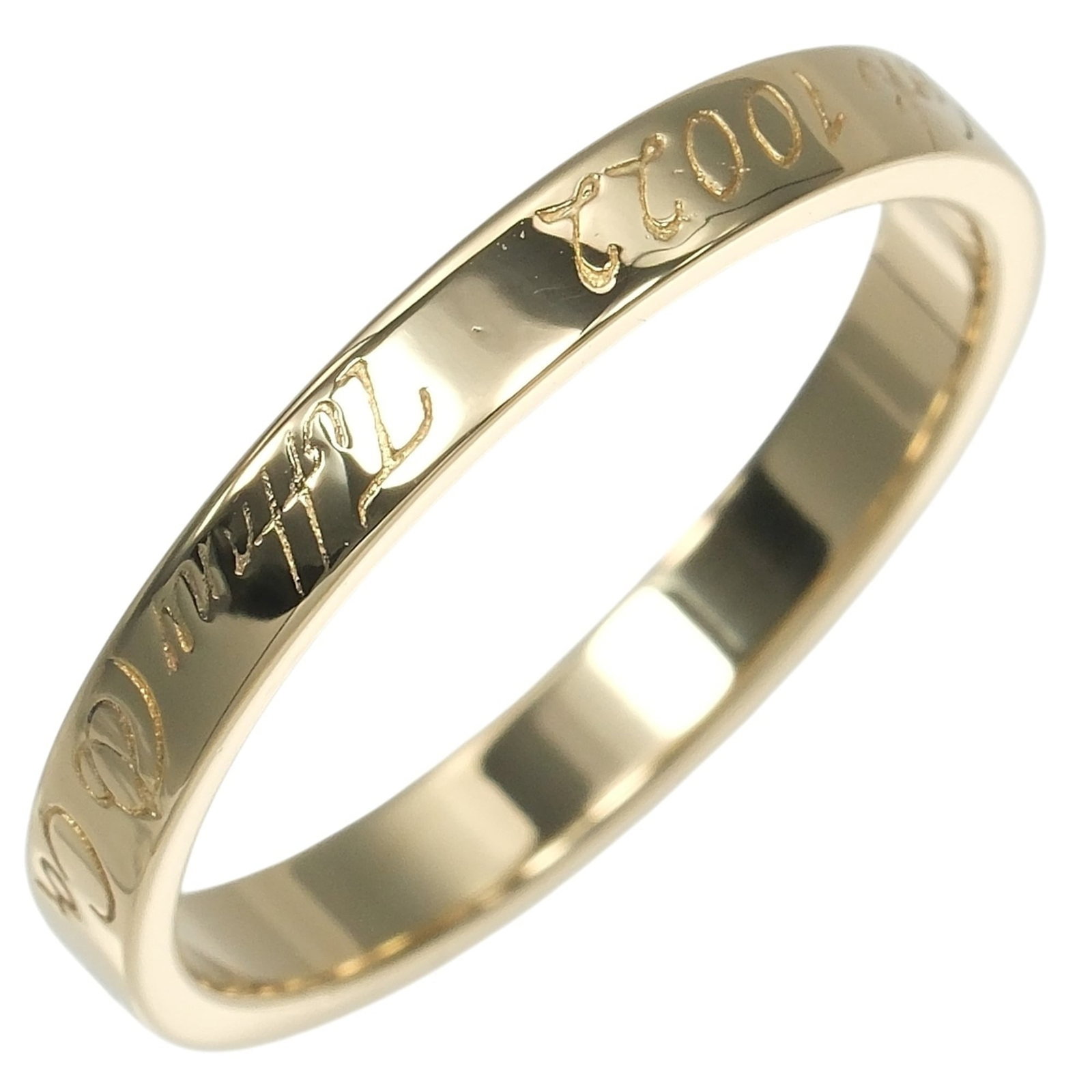 Tiffany Ring Gold Yellow 18K: Tiffany Ring Gold Yellow 18K This Tiffany ring features a beautiful gold yellow 18K band, a notable detail of its design. The item has been well-cared for and shows some minor signs of wear, including