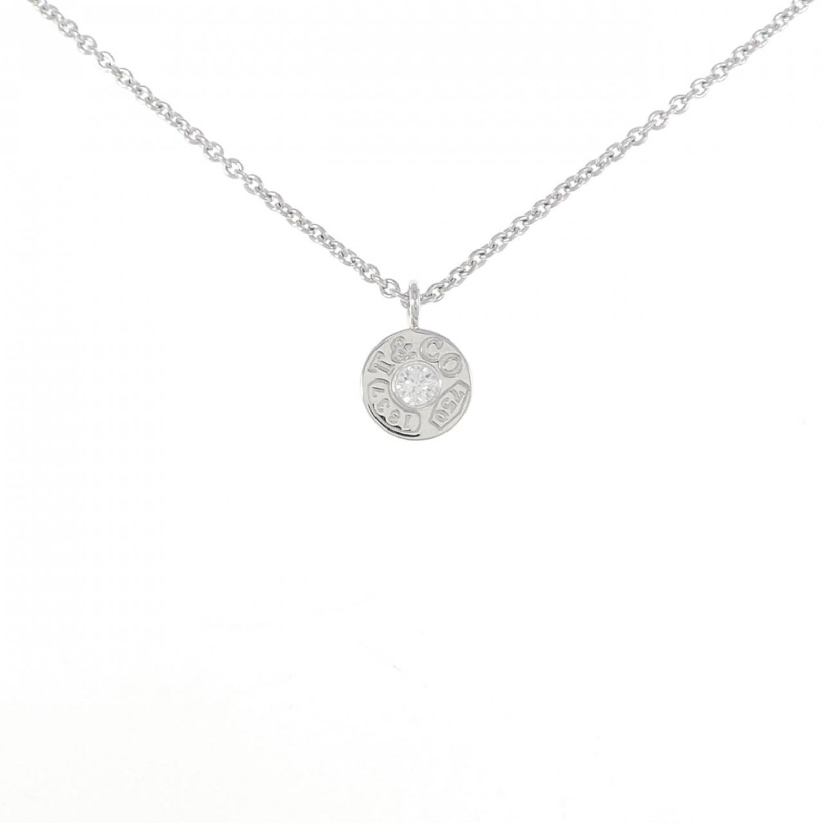 Circle necklace Tiffany 1837: Circle necklace Tiffany 1837 Tiffany & Co.'s iconic 1837 necklace boasts an elegant white gold design with a 8mm pendant, perfectly complemented by the 41cm chain circumference. This beautifully craft