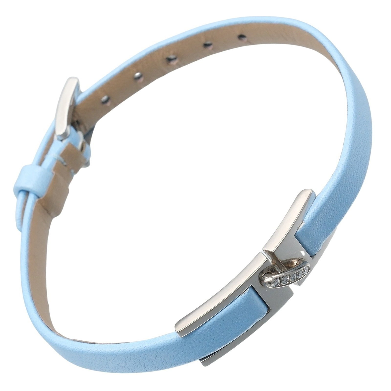 Chaumet Charm Bracelet Leather White Gold (18K): Chaumet Charm Bracelet Leather White Gold (18K) Chaumet's iconic charm bracelet features supple leather and elegant white gold accents, adorned with a sparkling diamond. This 18K white gold piece boas