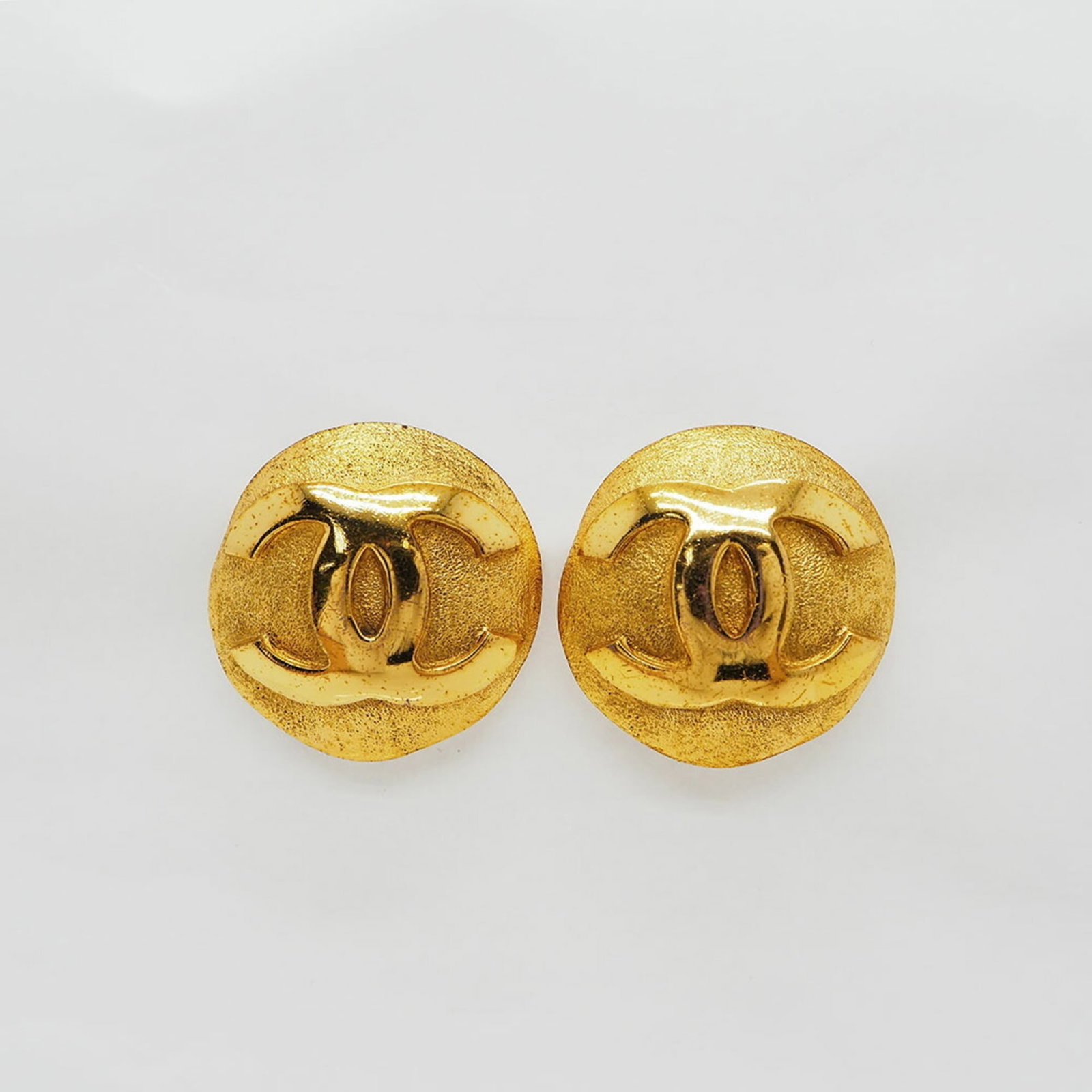 Coco Chanel 9 Gold Big Round Earrings: Coco Chanel 9 Gold Big Round Earrings The Coco Chanel 9 Gold Big Round Earrings are a stunning example of vintage luxury, boasting a sleek gold finish and substantial size. Measuring 33mm in diameter,