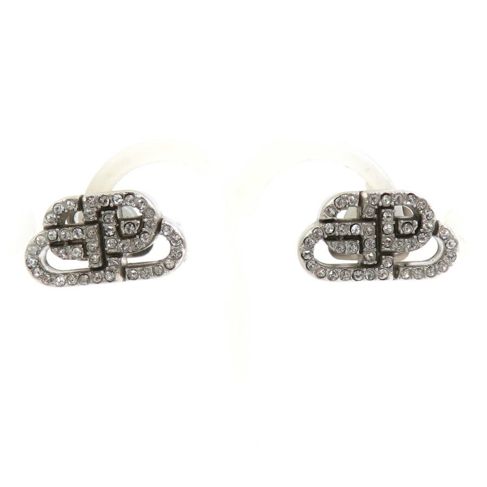 Metal rhinestone stud earrings by Balenciaga: Metal rhinestone stud earrings by Balenciaga Metal rhinestone stud earrings by Balenciaga, featuring silver metal and intricate rhinestones. In very good condition, with a few traces of usage and